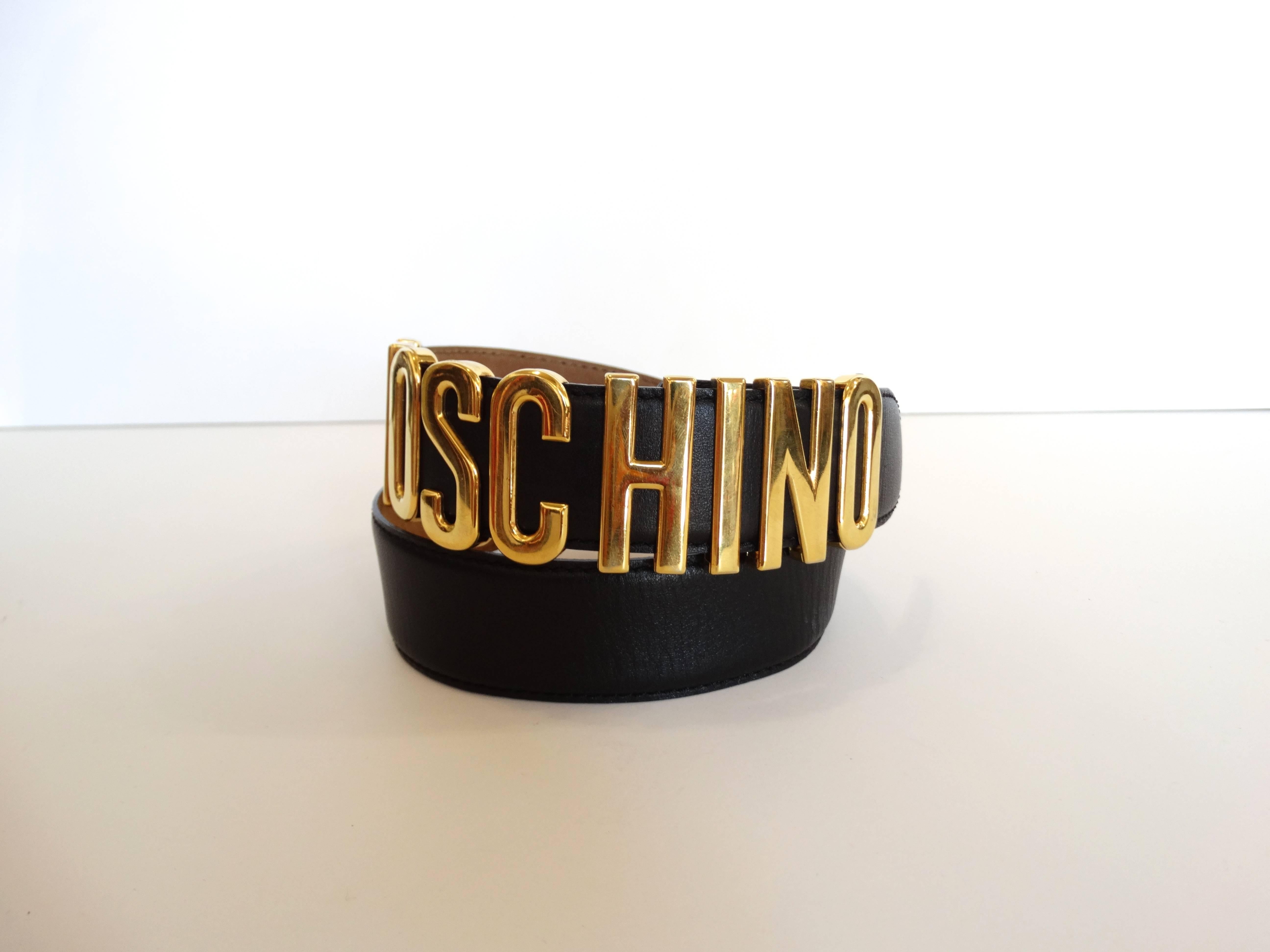 Moschino Letter Logo belt! “MOSCHINO” letters cast in brilliant gold metal. “M” and “O” are bolted down, the rest of the letters slide along the belt. Soft black italian leather belt. Three punched holes with double hook closure. 

Marked: 38
Total