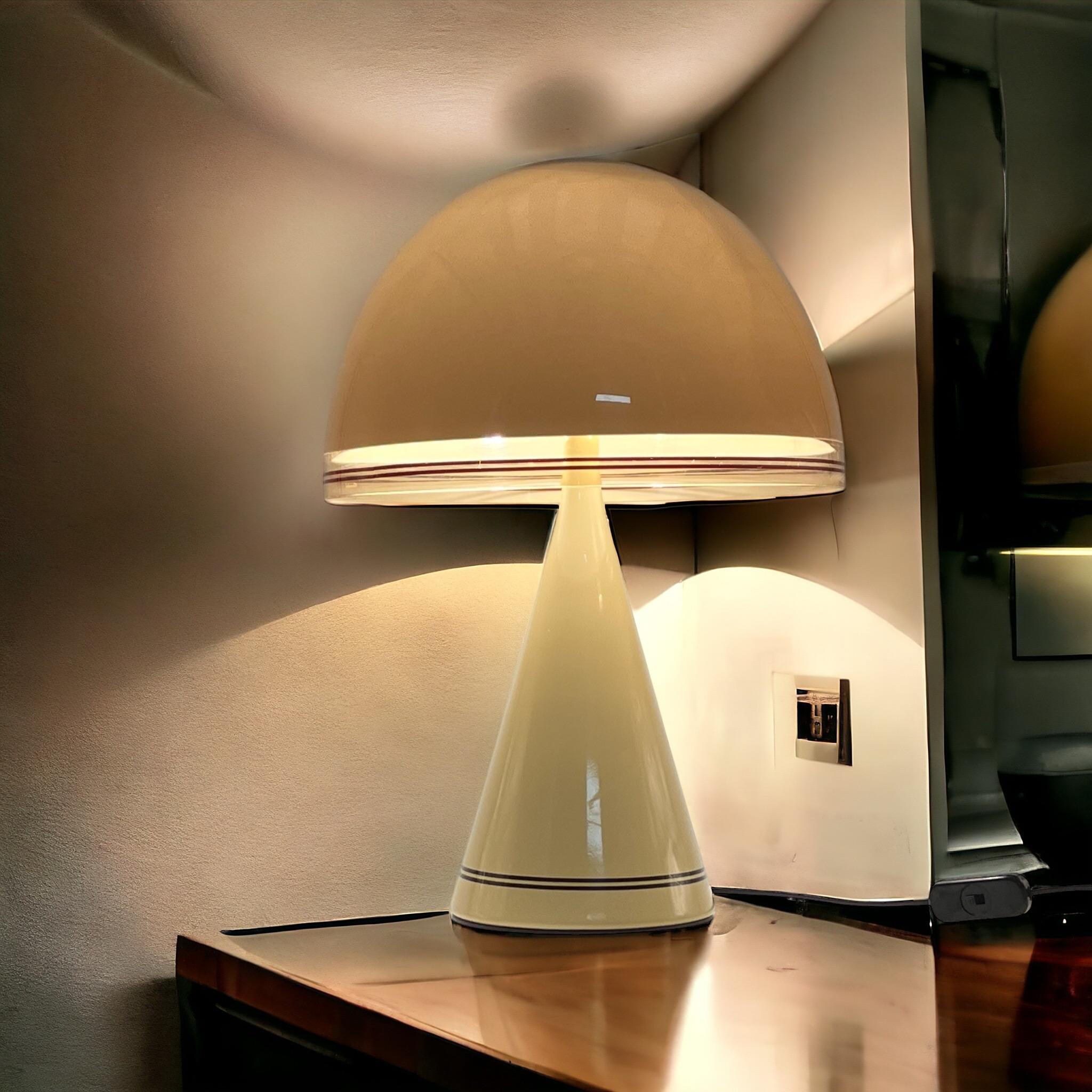 Embrace the vibrant spirit of Space Age design with this iconic Mushroom 70s Lamp ‘Baobab’ by iGuzzini, a stunning creation by the esteemed Italian design team in 1976, produced from 1978 until 1992. The ‘Baobab’ table lamp boasts a striking