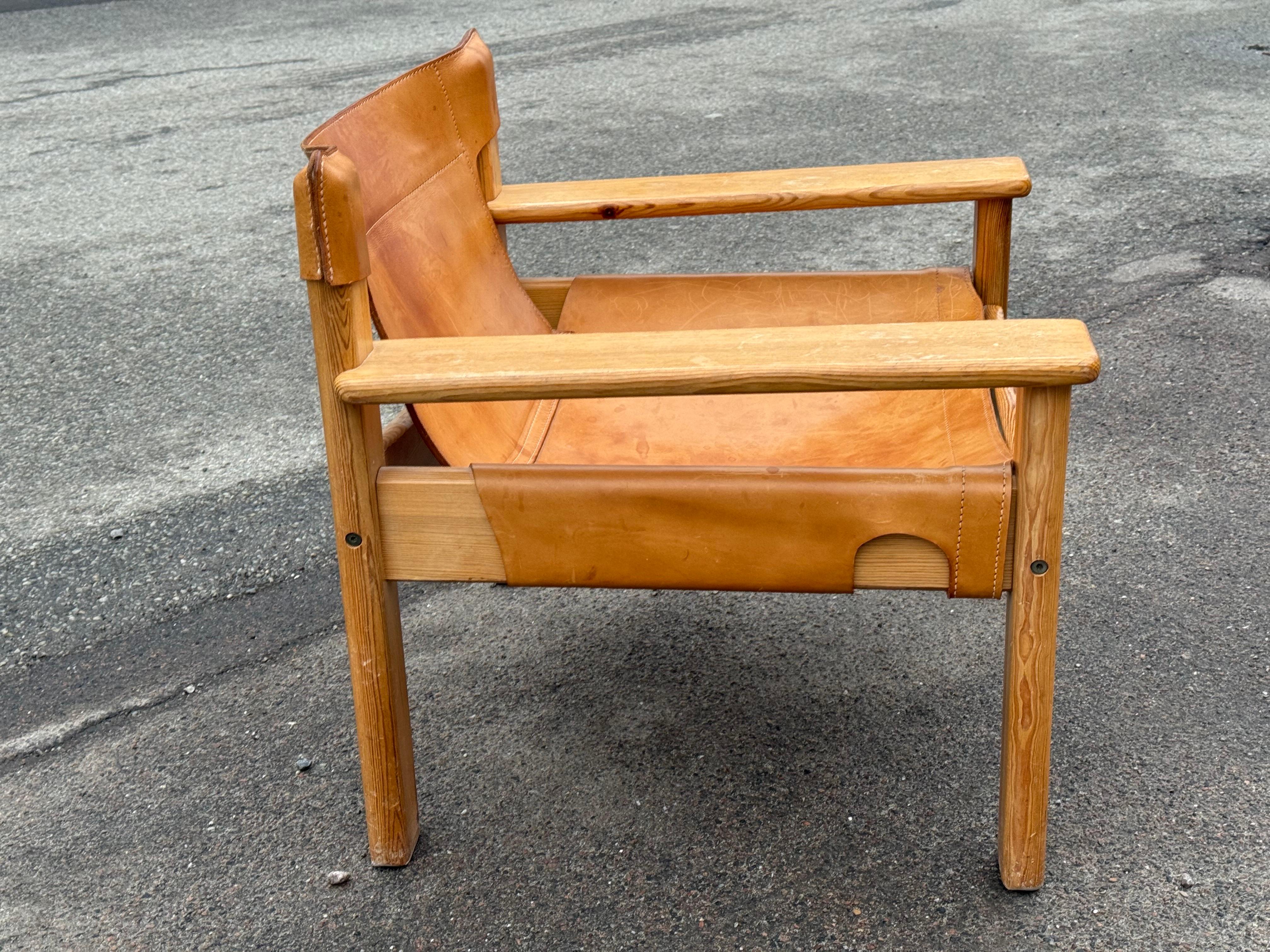 Charming Swedish Mid Century Modern lounge chair in solid pine, upholstered in beautifully patinated leather . Designed by Karin Mobring, model 