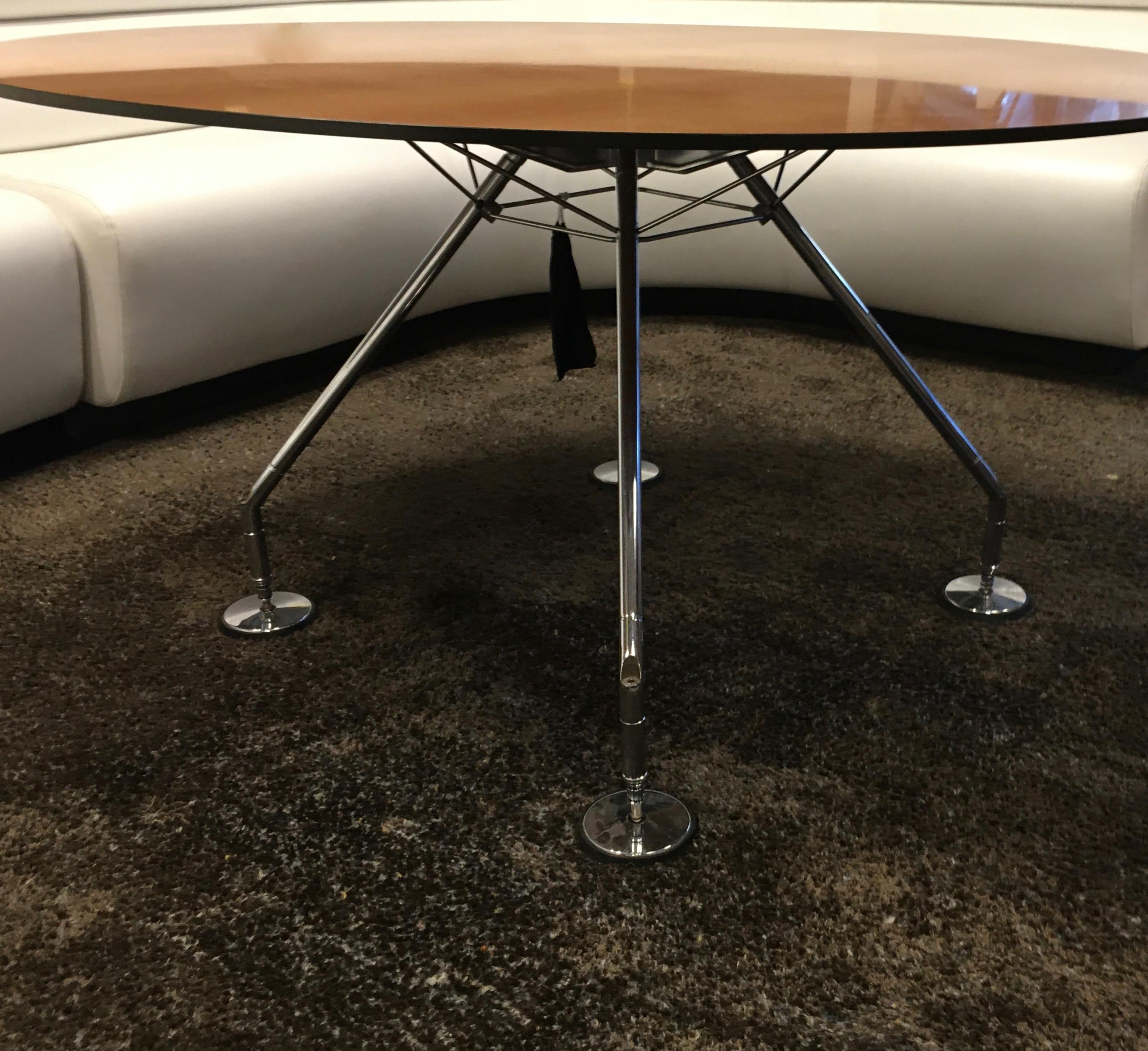Futurist dining or conference table with a light walnut top.
Designed by Norman Foster for Tecno.
Italy around 2000.