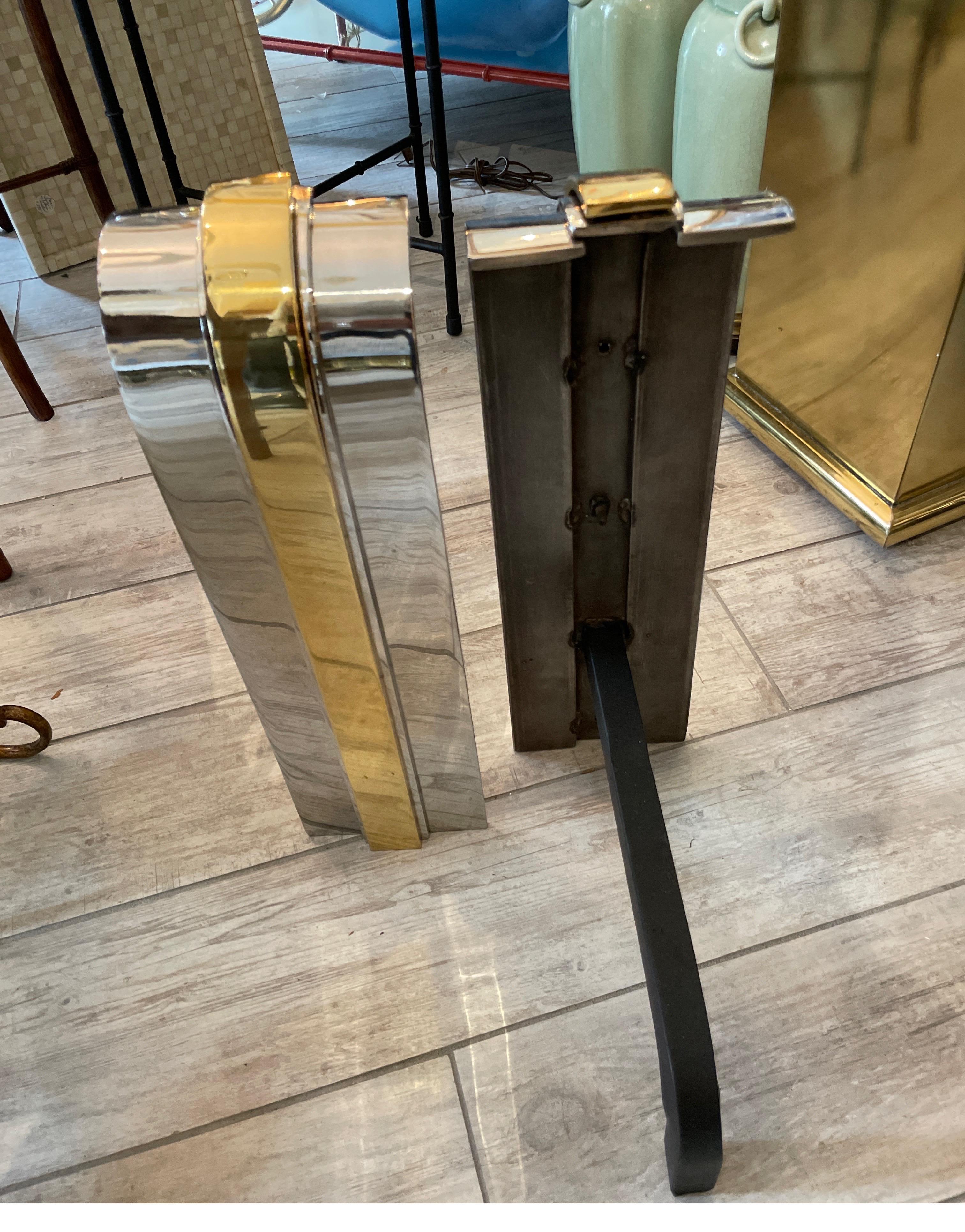 American Iconic Pair of Polished Chrome & Brass Andirons by Danny Alessandro For Sale