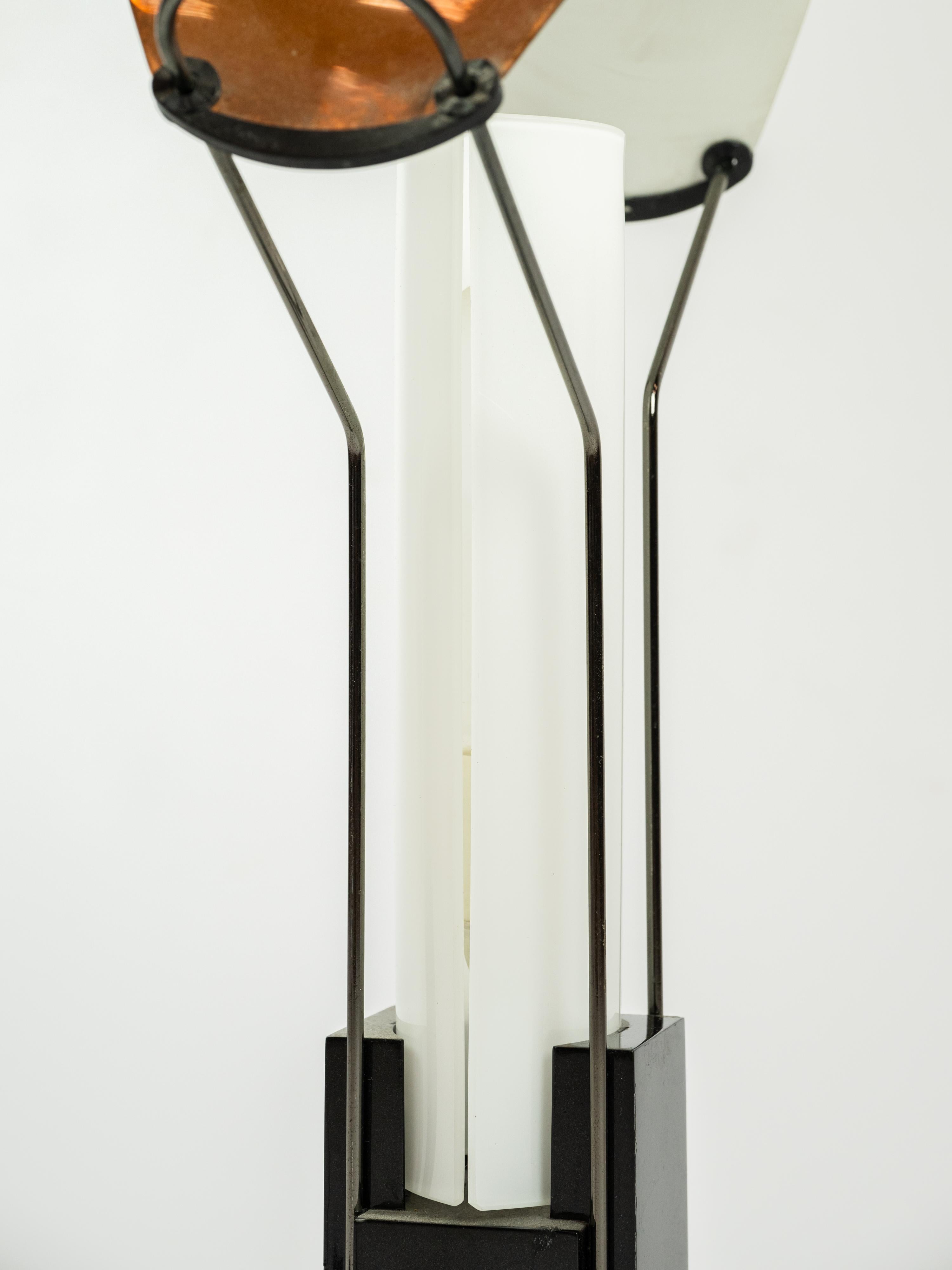 The PALIO lamp by ArteLuce is a sophisticated blend of contemporary design and timeless elegance. Crafted with meticulous attention to detail, it features a sleek metal frame complemented by a softly diffused shade, creating a warm and inviting