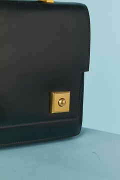 Iconic "Piano" top handle bag  in black leather Hermès