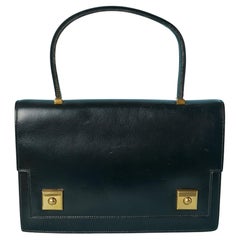 Icónico bolso de asa superior "Piano  en cuero negro Hermès