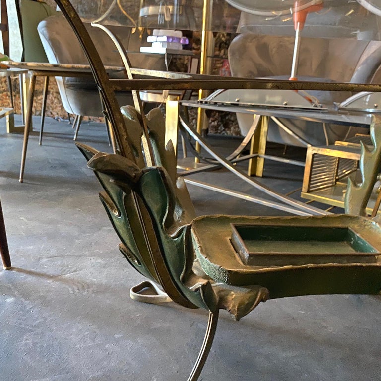 It's a wood, brass and glass italian side table designed by Pier Luigi Colli, probably the original glass has been changed, it's in perfect conditions.