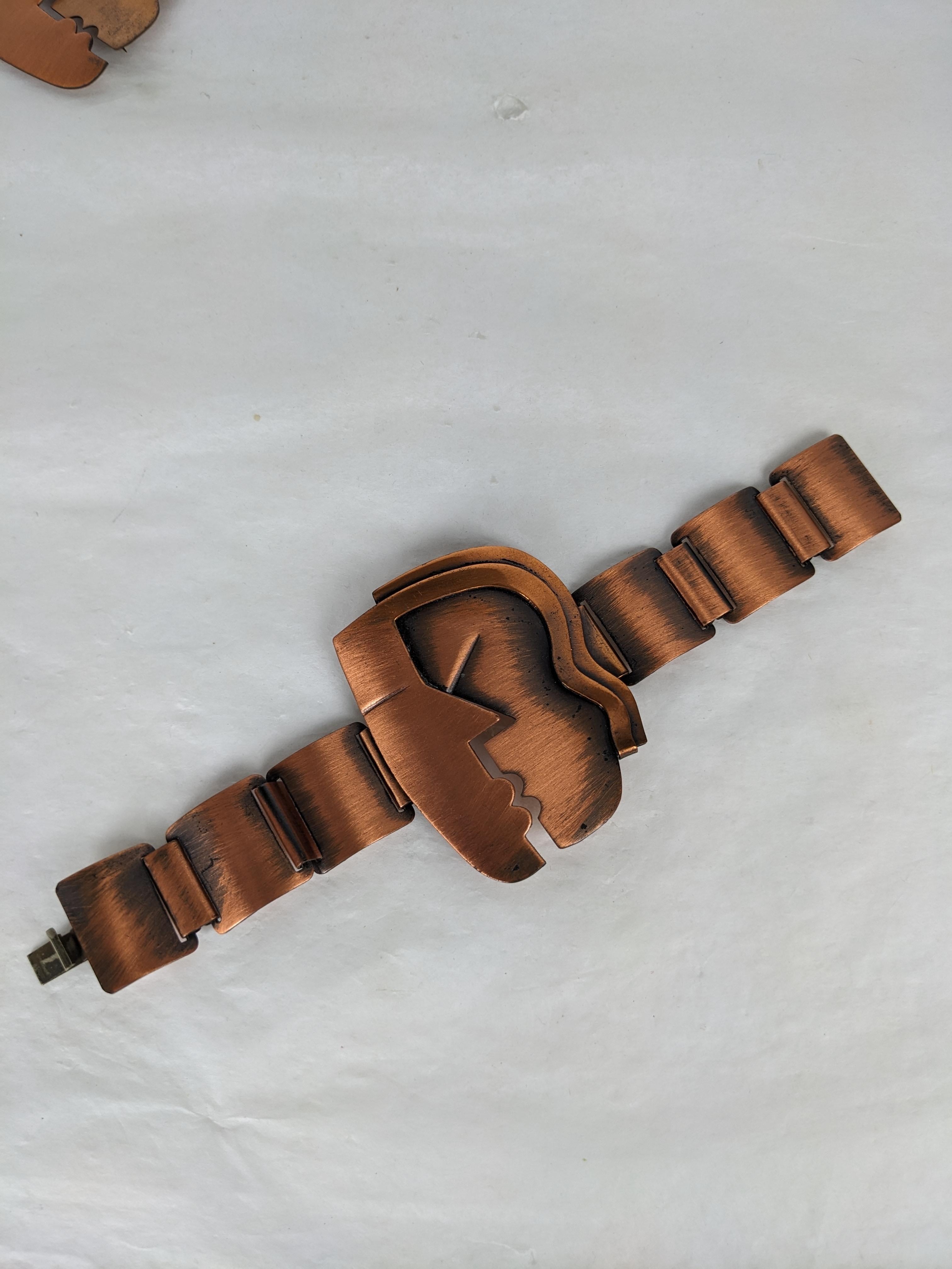 Rare and Iconic Rebajes Copper Kiss Bracelet from the 1940's. Superb modernist design of copper with patina accents. 2.25