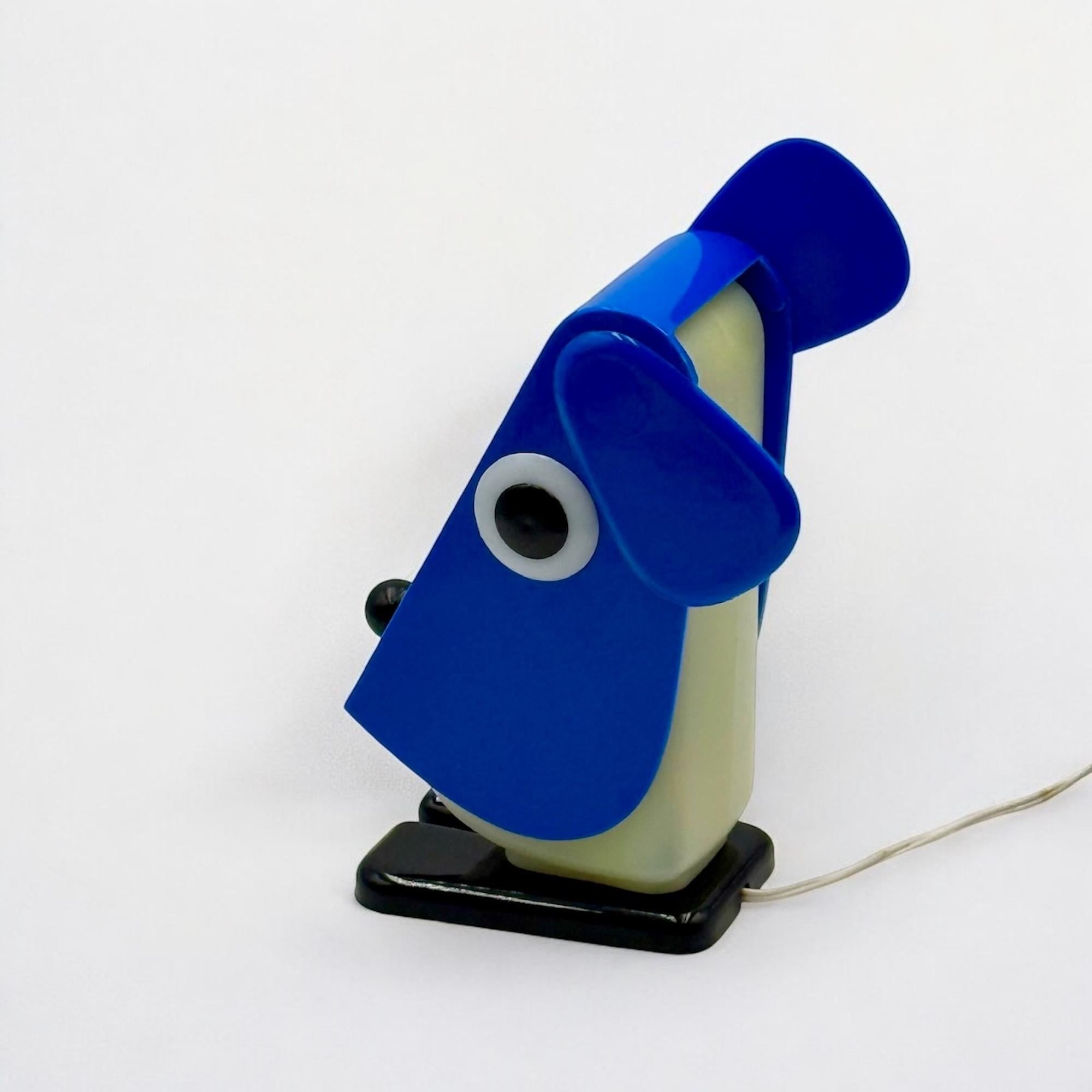 The 'Rufus' lamp, designed by Fernando Cassetta for Tacman Manara in the early 70s, is a standout example of innovative design and bold aesthetics. This hyper-rare piece features a relaxing blue, white, and black color scheme, crafted entirely in
