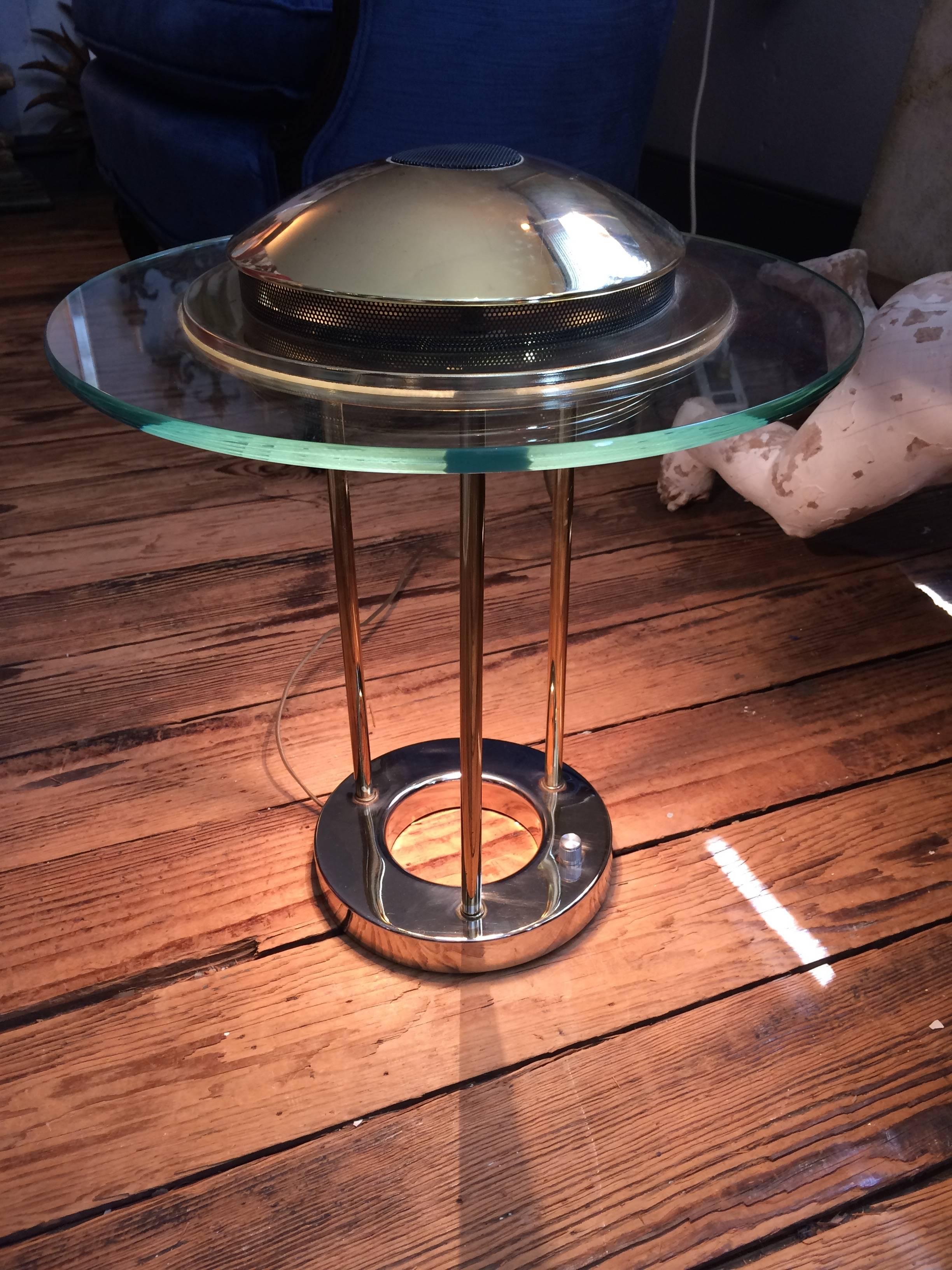 Fantastic 1980s Robert Sonneman designer desk lamp for George Kovacs - glass saturn style top with brass rods and polished zinc base. Zinc base is 8 inches diameter.
SW