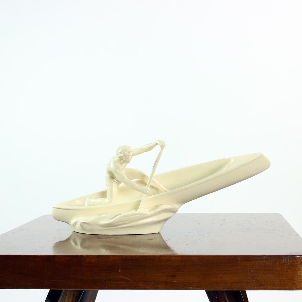 Iconic vintage sculpture of a rower. Produced by Jihokera in Czechoslovakia in 1960s. The sculpture was very popular in the Communist regime of Czechoslovakia. It has a great presence, style and great sense of details. It shows a strong, sporty male