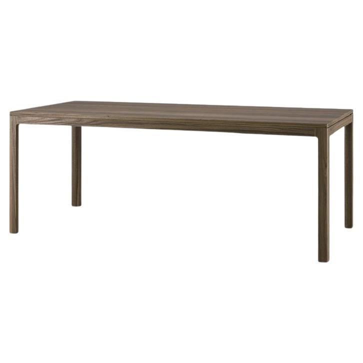  Priced here in oak wood in 200 cm width. 
Contact us for other sizes and walnut wood. 
This dining table is designed to elevate every aspect of its composition, ensuring that each detail shines brightly. Inspired by the timeless silhouette of a