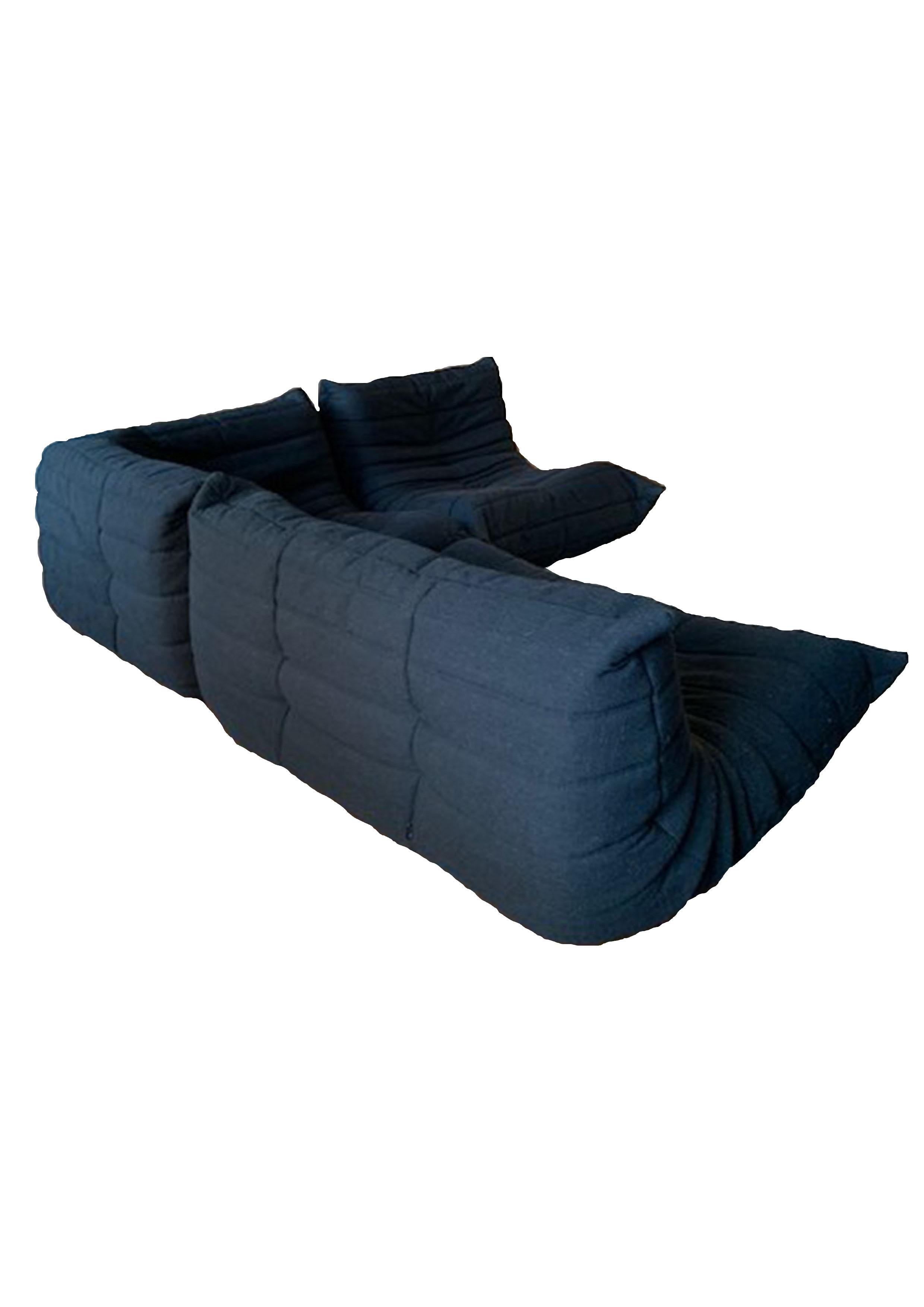 Iconic Sofa 'Togo' designed by Michel Ducaroy for Ligne Roset. It was created in 1973. 
This set is composed of a two-seater (70x131x102), a corner (70x102x102) and a single-seater (70x87x102).
It is very comfortable, the fabric covers are recent