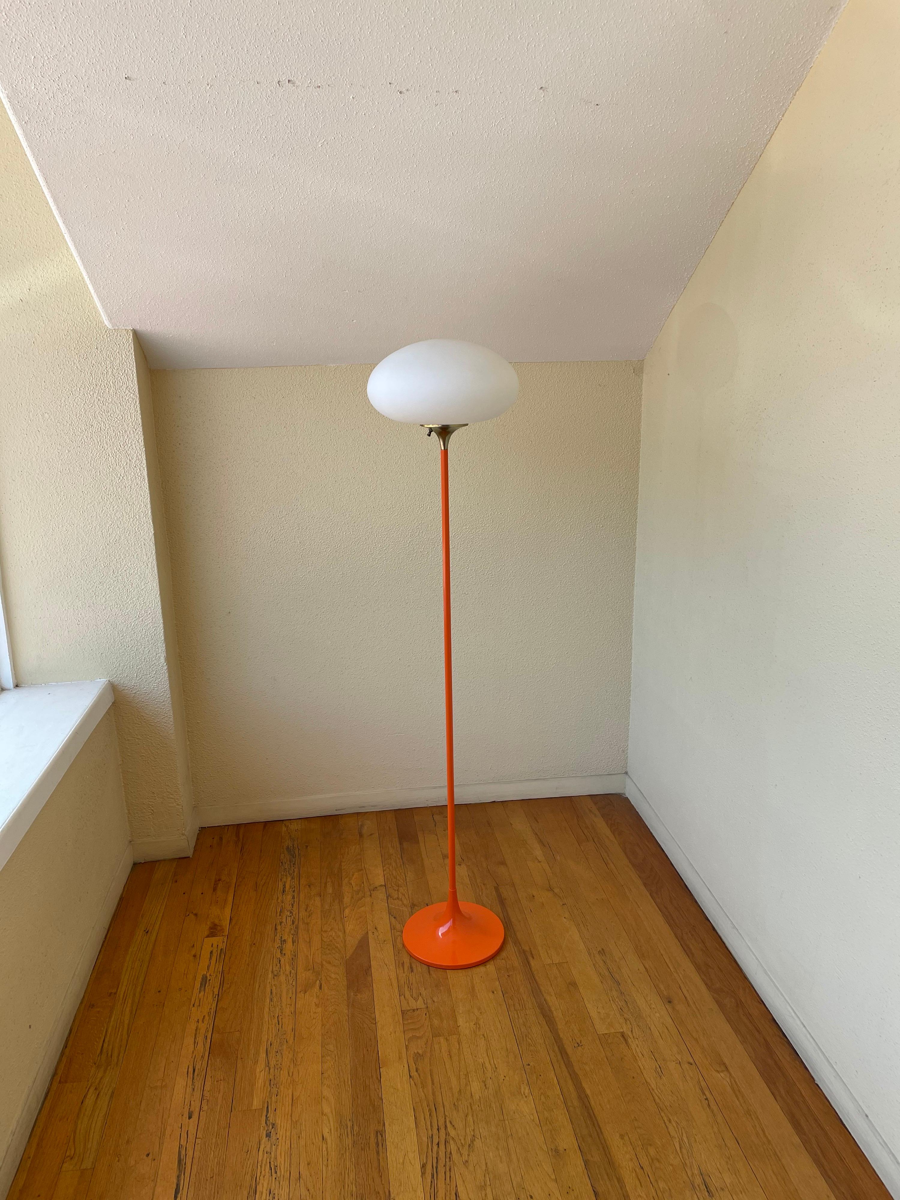 Iconic 1960s mushroom shade floor lamp, designed by Laurel, American, circa 1960s. The lamp its been rewired and sandblasted to an orange color enameled finish we left the top in brass to give an accent piece, some scuffs and marks due to age the