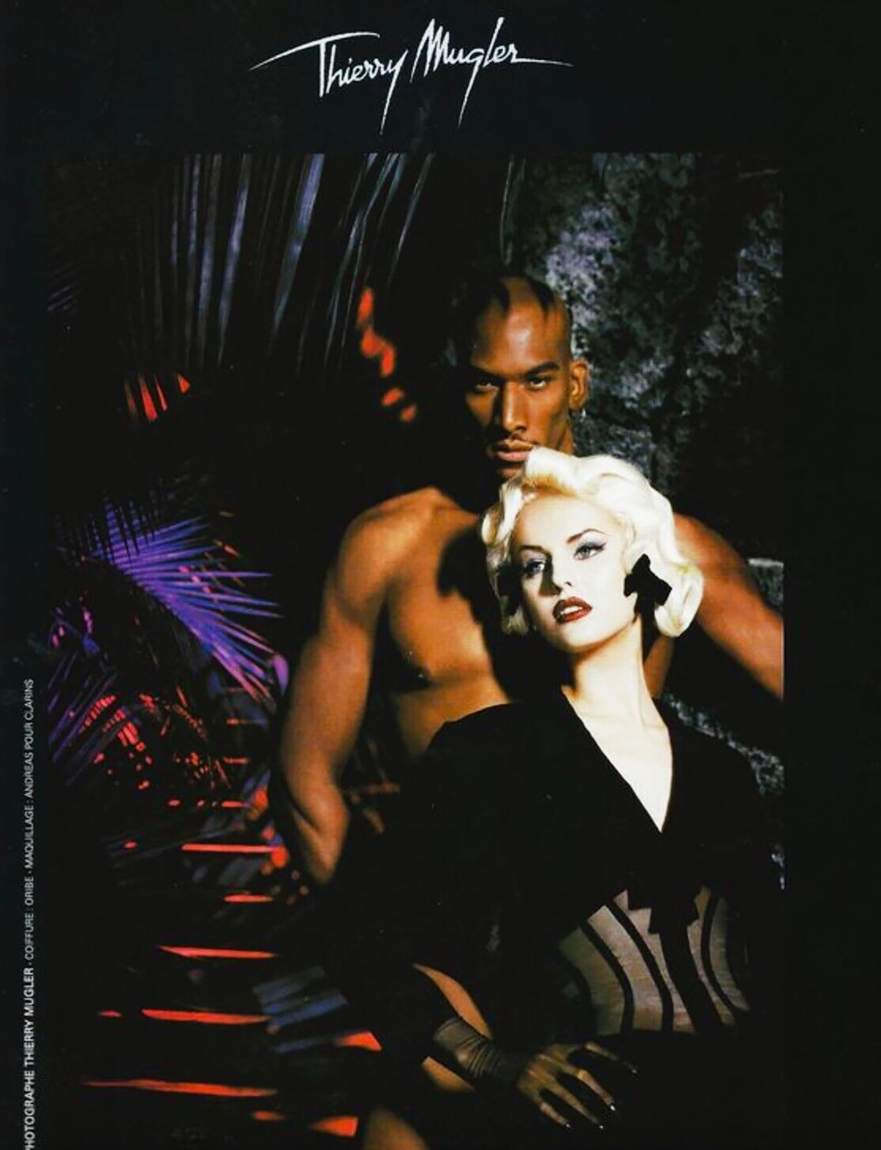 Museum worthy piece of Fashion History

The fabulous iconic archival Thierry Mugler jacket with sheer boned corset waist. 
Collection 1995, featured on the Runway show'Best of Thierry Mugler / Summer Collcetion 95' in Berlin. Also featured in the
