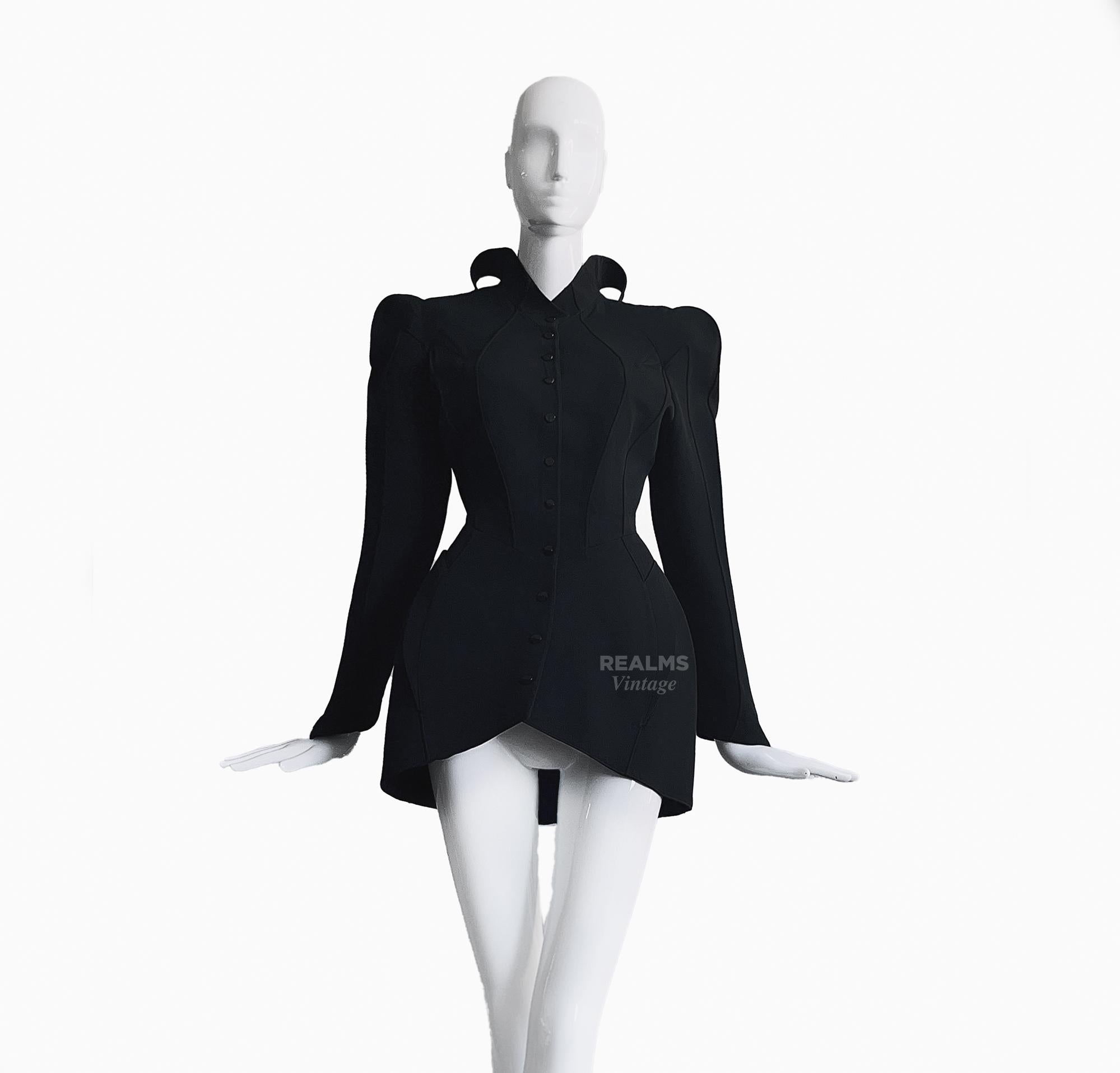 
Showstopper!
Thierry Mugler LES INFERNALES Collection FW 1988/89
Absolutely extraordinary piece! The shape and tailoring is so remarkable and the Collar is spectacular! 
Sculptural dramatic black two piece set: Jacket and Skirt.

This truly is