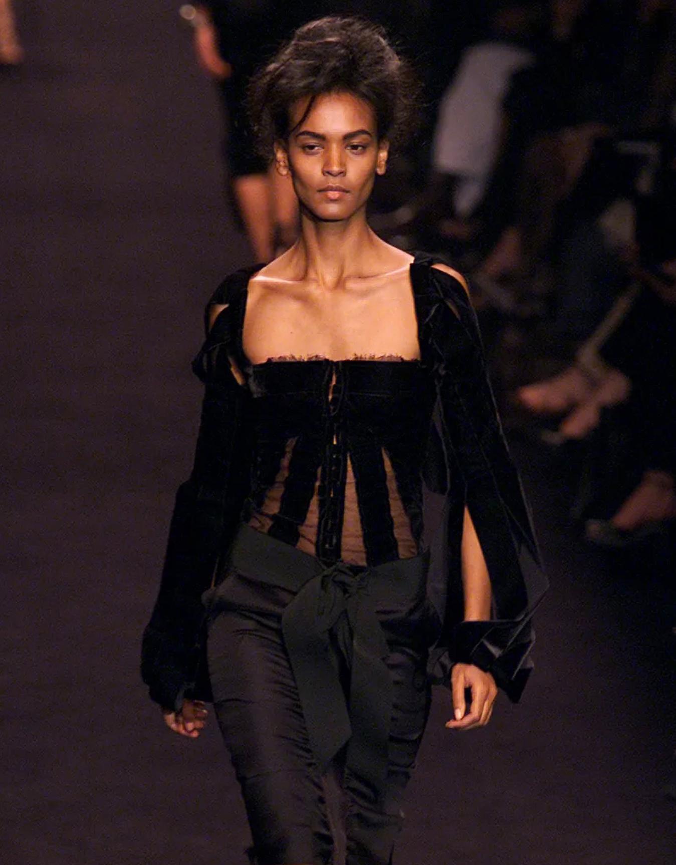 
SHOWSTOPPER

Iconic Runway Tom Ford for Yves Saint Laurent Ensemble F/W 2002 Collection

Two piece set made of pure Silk (corset top and skirt) TOM FORD for YVES SANT LAURENT

The corset top crafted from panels of high quality black velvet fabric