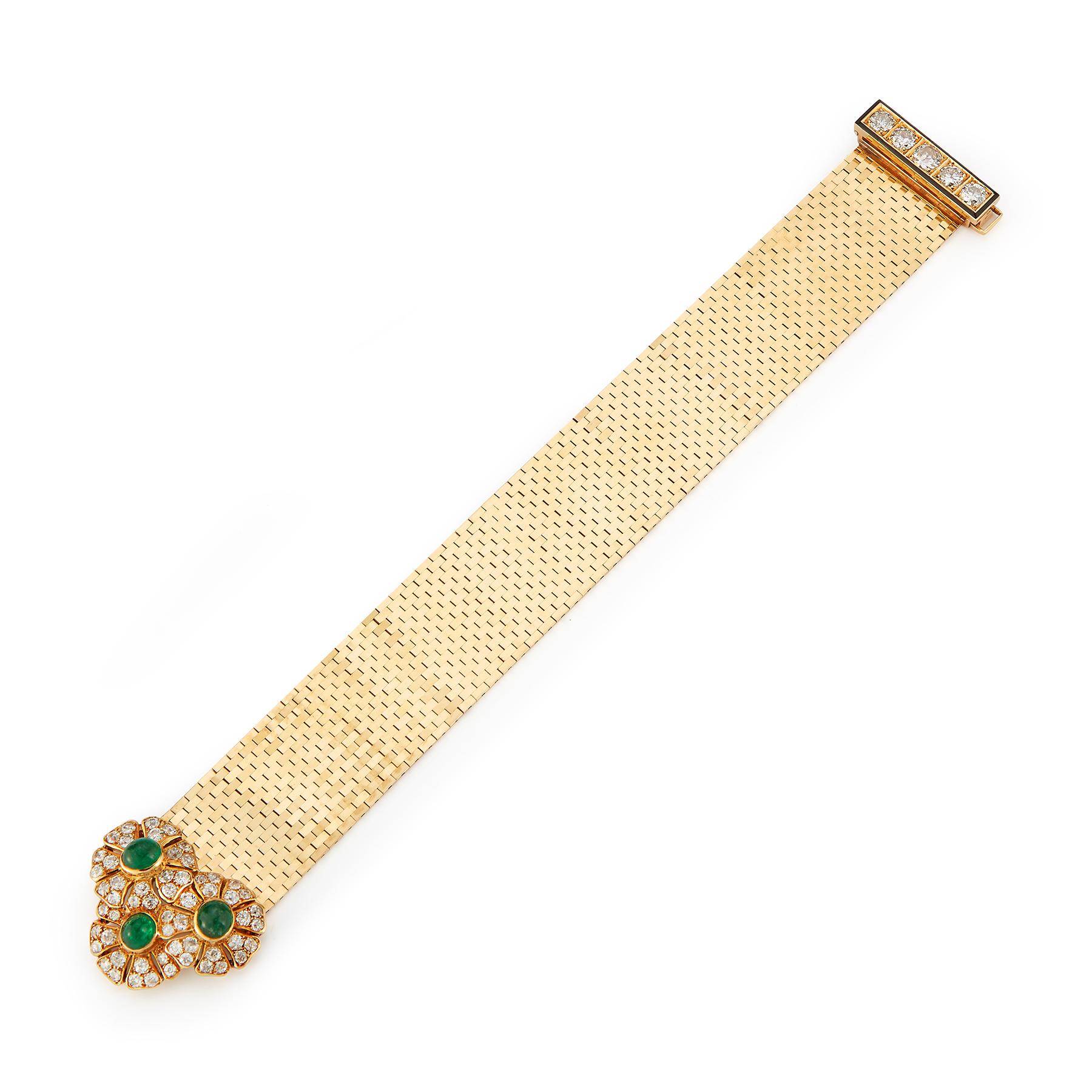 Iconic Van Cleef and Arpels Ludo Bracelet
3 large cabochon emeralds surrounded by 56 round cut diamonds & 5 larger antique cut diamonds on the clasp accented with black enamel. 
Signed and numbered. 
Made circa 1940
Gold Type: 18K Yellow Gold