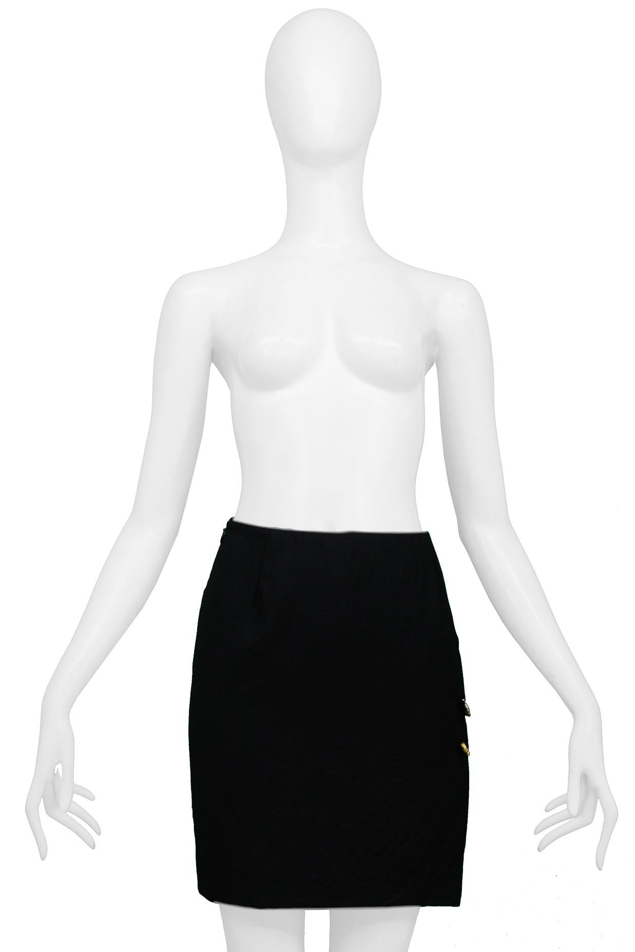 Resurrection Vintage is excited to offer a vintage Gianni Versace black crinkle fabric mini skirt featuring iconic safety pins, a side slit, and an invisible zipper. 

Size 40
Length: 17