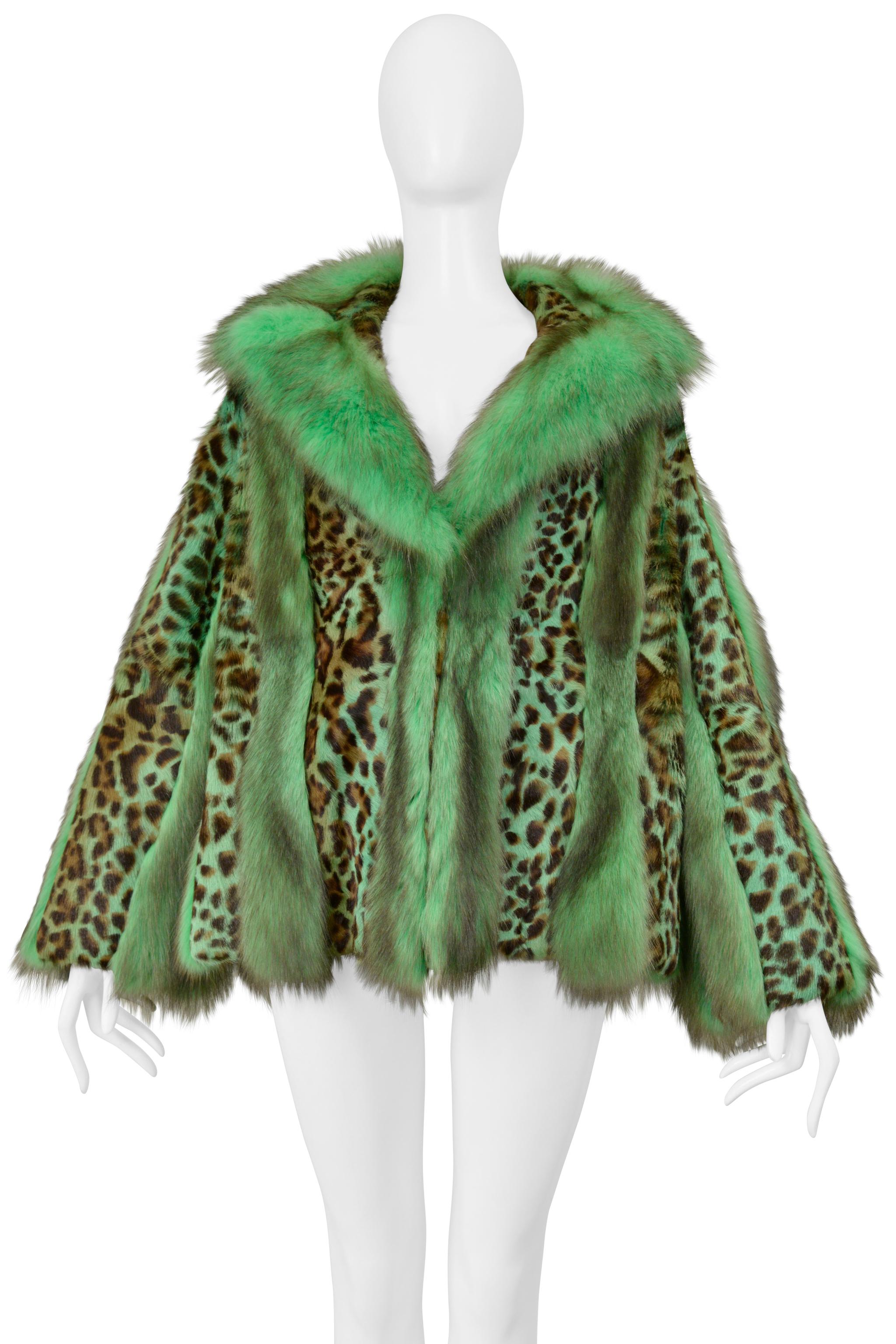 Resurrection is excited to offer a rare and unusual Versace fur coat from the 2004 collection. The green fox fur coat features plush and full fox panels, leopard print panels, an oversized easy body, and graphic zebra print lining with 
