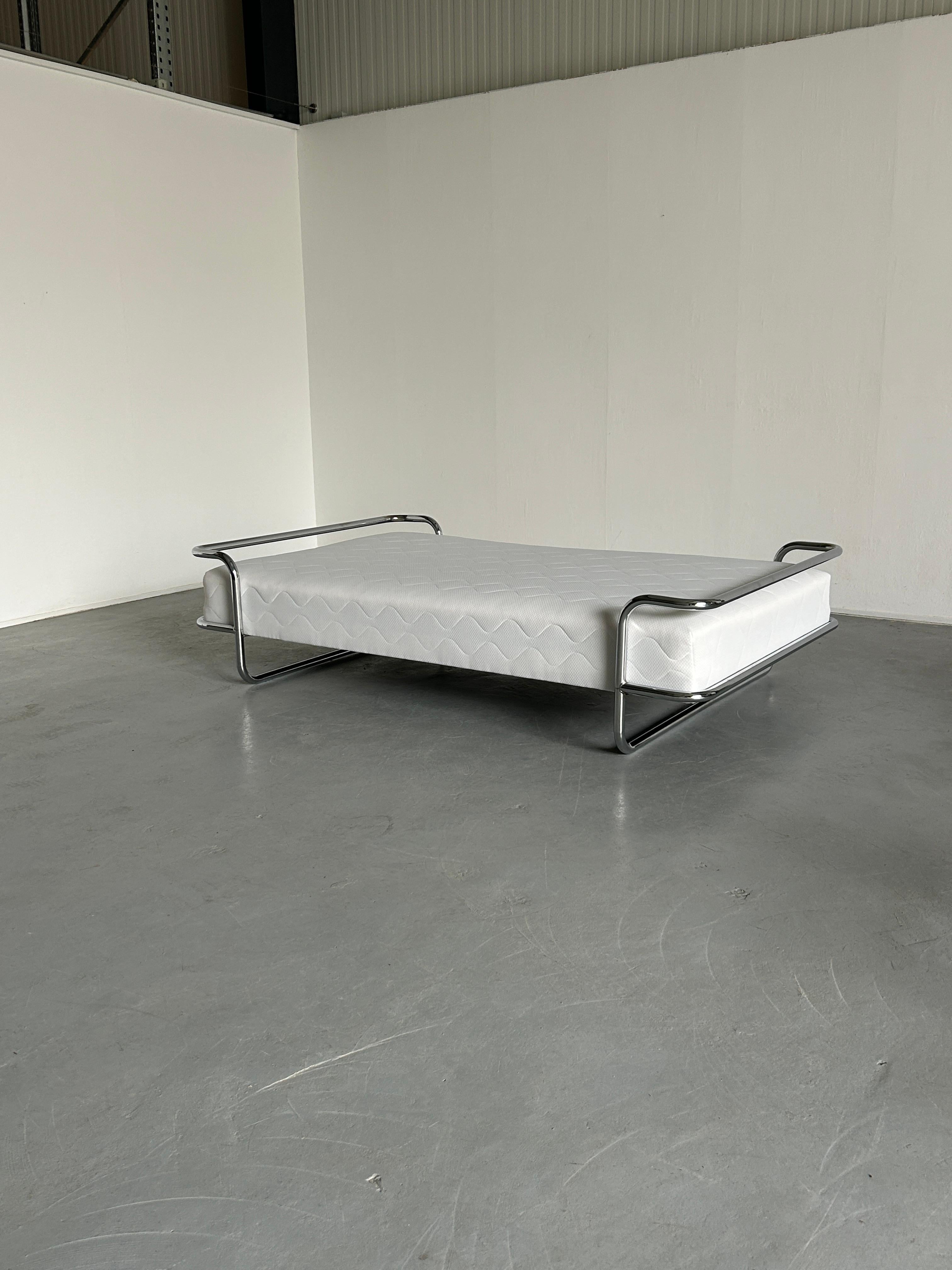 The iconic and rare vintage Ikea KROMVIK chrome bed with the original SULTAN sprung mattress, designed by Knut Hagberg, 1982.
The smaller version with an integrated small double mattress (120cm).

The modernist form takes clear inspiration from