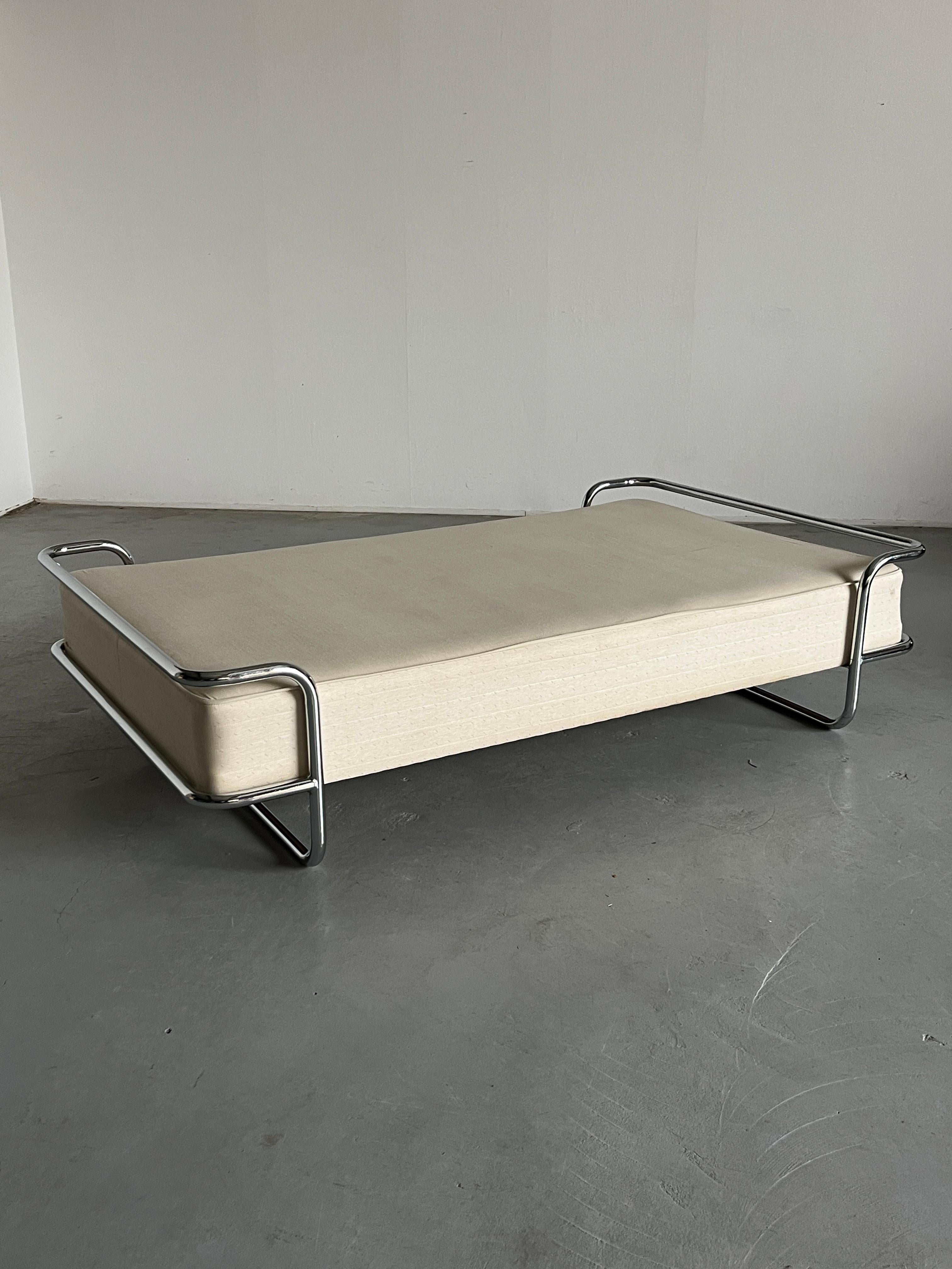 The iconic and rare vintage Ikea KROMVIK chrome bed with the original SULTAN sprung mattress, designed by Knut Hagberg, 1982.
The smaller version with an integrated small double mattress (120cm).

The modernist form takes clear inspiration from