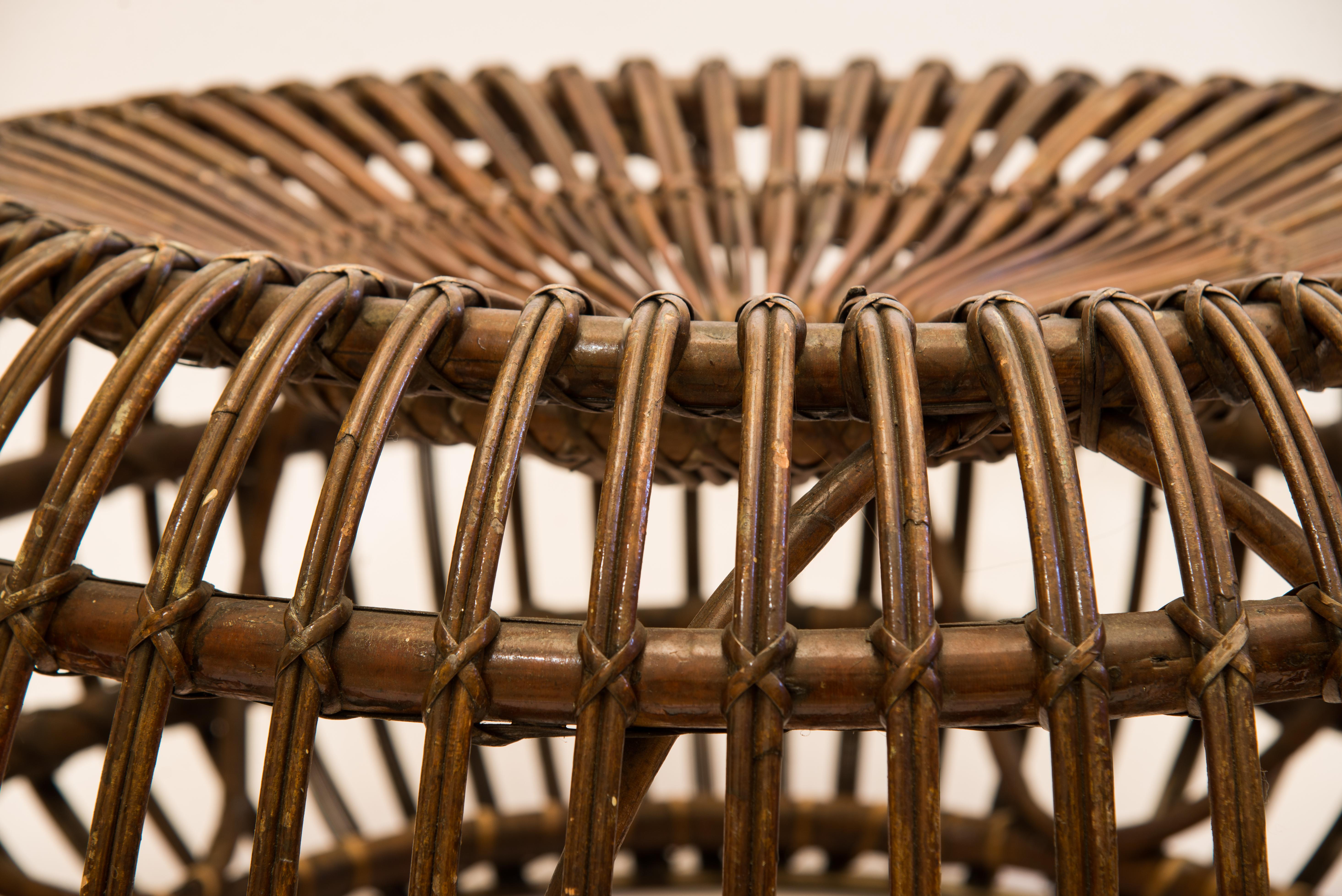 Mid-century wicker rattan ottoman
Italy, ’50 - ’60
Measures: Diameter : 76 cm; Height : 38 cm

Iconic Mid-century ottoman, in the style of Italian designer Franco Albini. 
Manufactured in Italy in the 1950's. Due to its large proportions, this