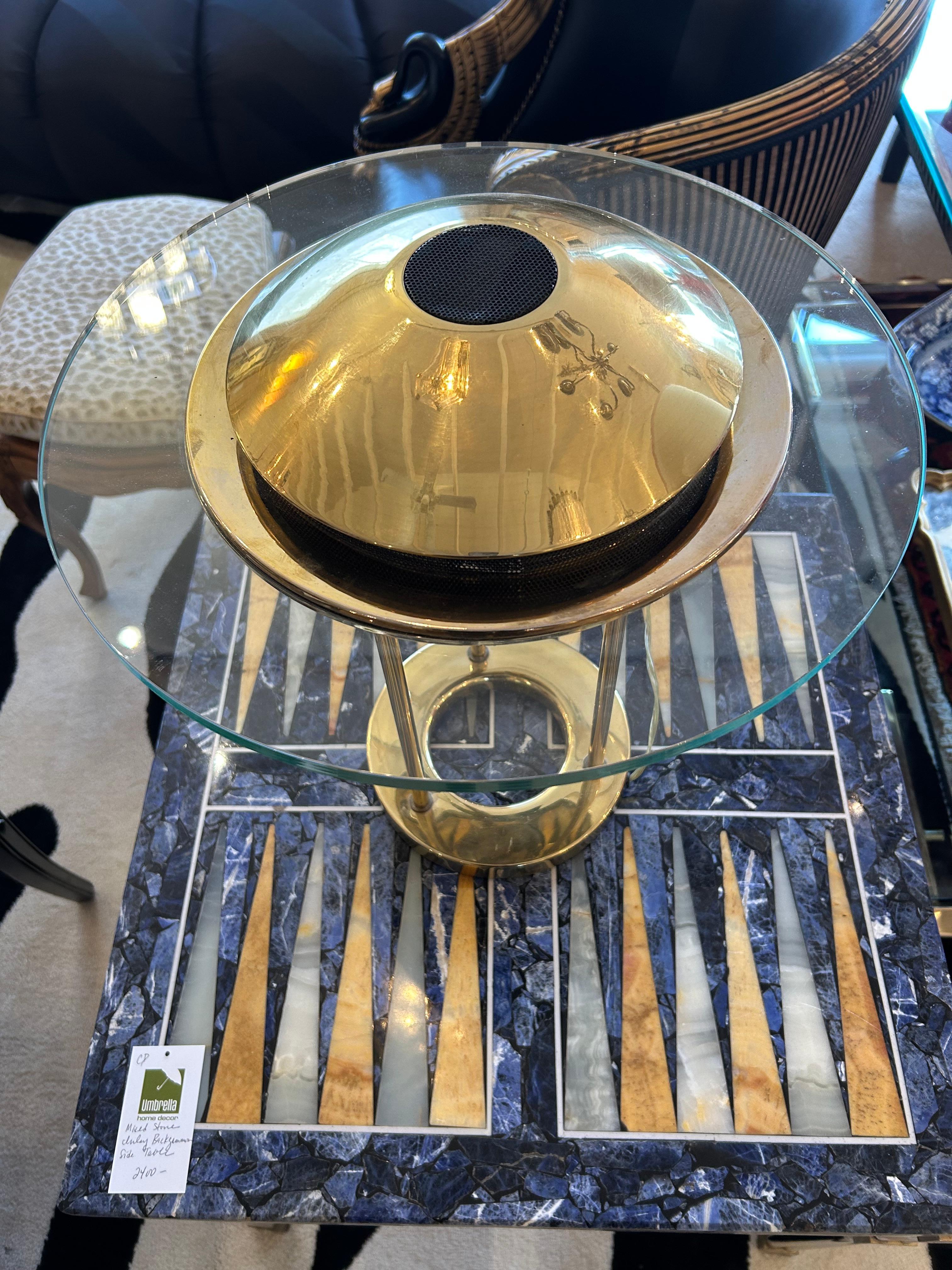 Iconic midcentury Sonneman “Saturn” lamp originally designed by George Kovacs having round glass top with brass dome on top.

CD