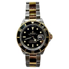 Montre-bracelet Rolex Submariner vintage emblématique, en acier et or, avec cadran noir