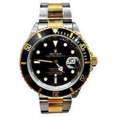 Montre-bracelet Rolex Submariner vintage emblématique, en acier et or, avec cadran noir