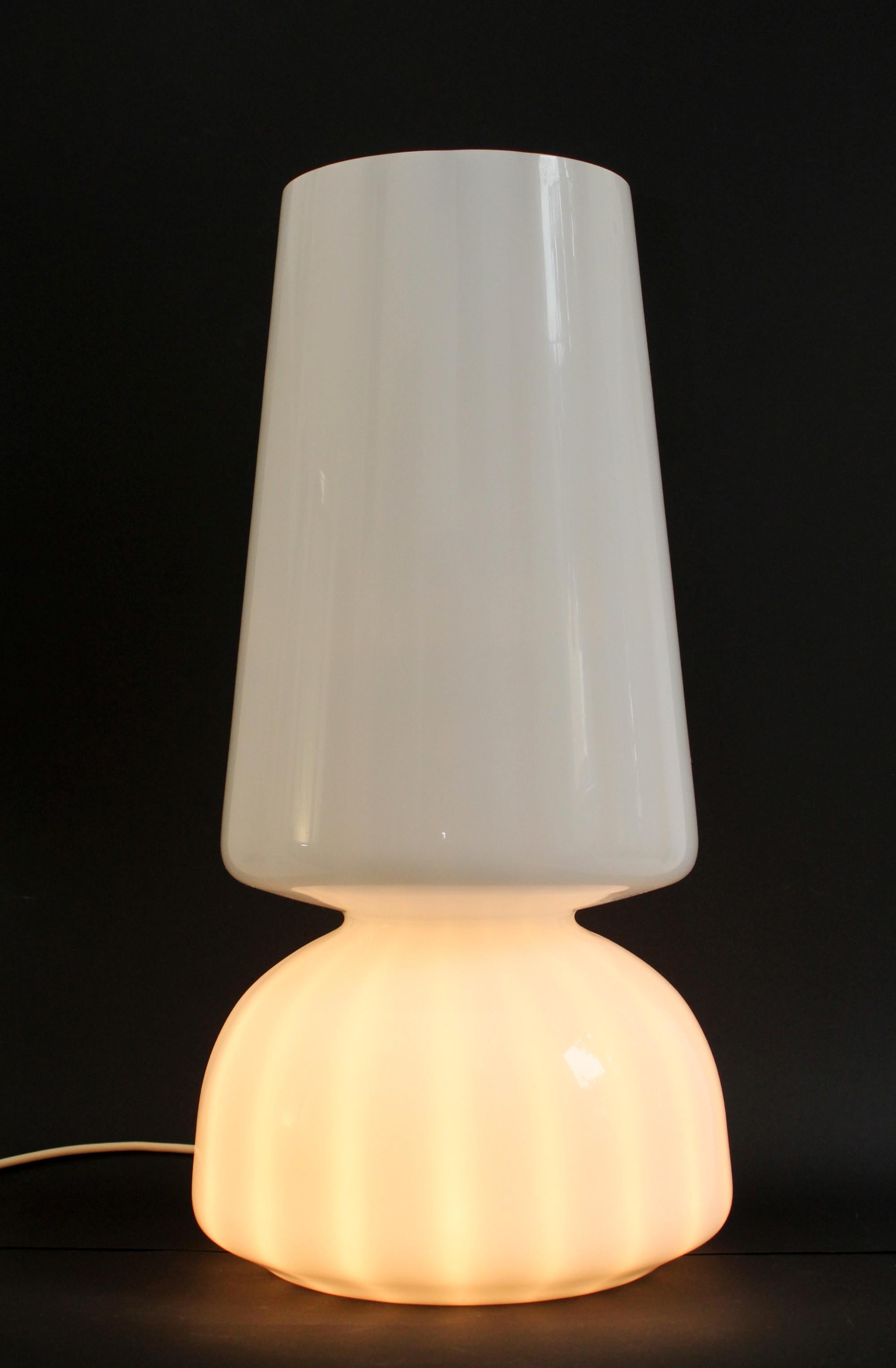 Gorgeous Large Murano Original: VeLuce - Italy.
White Glass Table Lamp from 1970s.
Technique: made of a single sheet of molded Murano glass.
Measurements (cm): 60 height x30 base diameter x 20 top diameter).
Double sockets (E27 + E14) - Bulbs