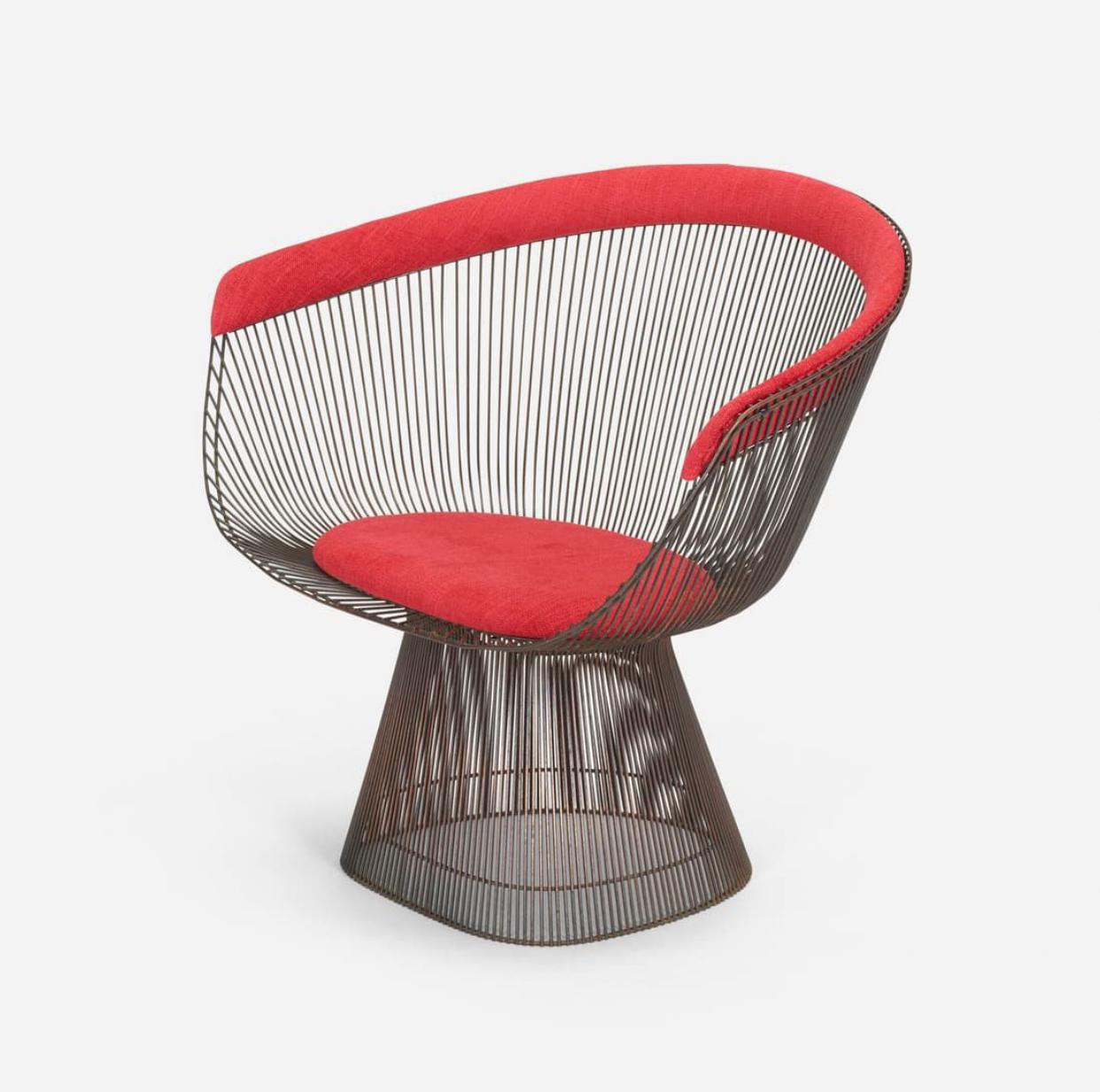 Iconic “wire” framed lounge chair designed by Warren Platner for Knoll Associates, 1966. The frame has been bronze plated and the upholstery is an updated red wool from the Knoll line of upholstery. 
From the Knoll website:
 In 1966, the Platner