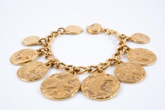 Iconic Yves Saint Laurent YSL Gold Tone Charms Bracelet