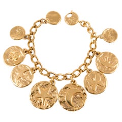 Iconic Yves Saint Laurent YSL Gold Tone Charms Bracelet