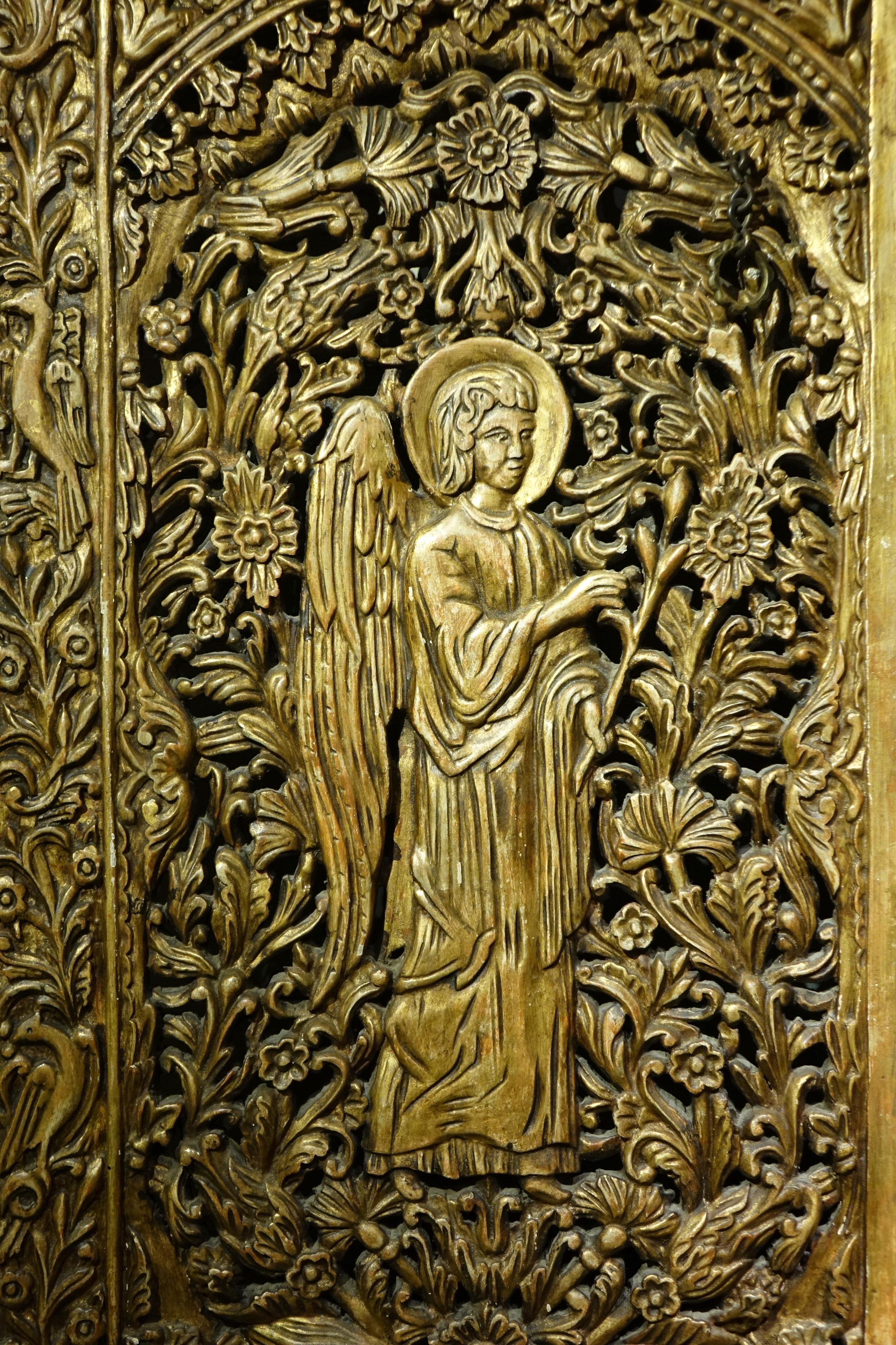 Carved and gilt wood door from an iconostasis representing the Annunciation to Mary by the archangel Gabriel.
The word 