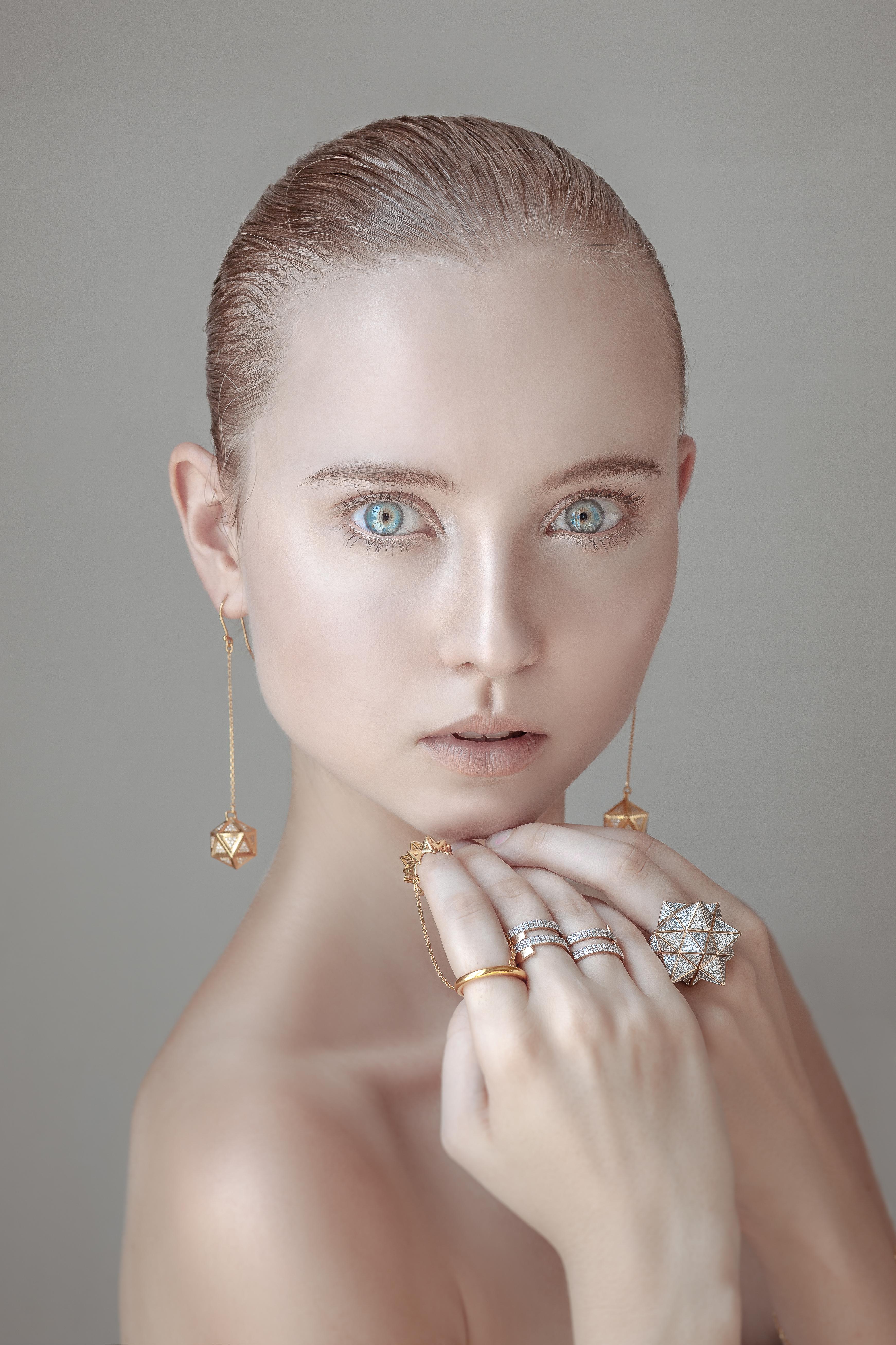 Inspired by sacred geometry and the Platonic solids, these Verahedra by John Brevard dangle earrings are created in 18K yellow gold with 240 round white diamonds at 1.0 mm each (1.2 carats total) and 2 round white diamonds at 2.0 mm each (0.07