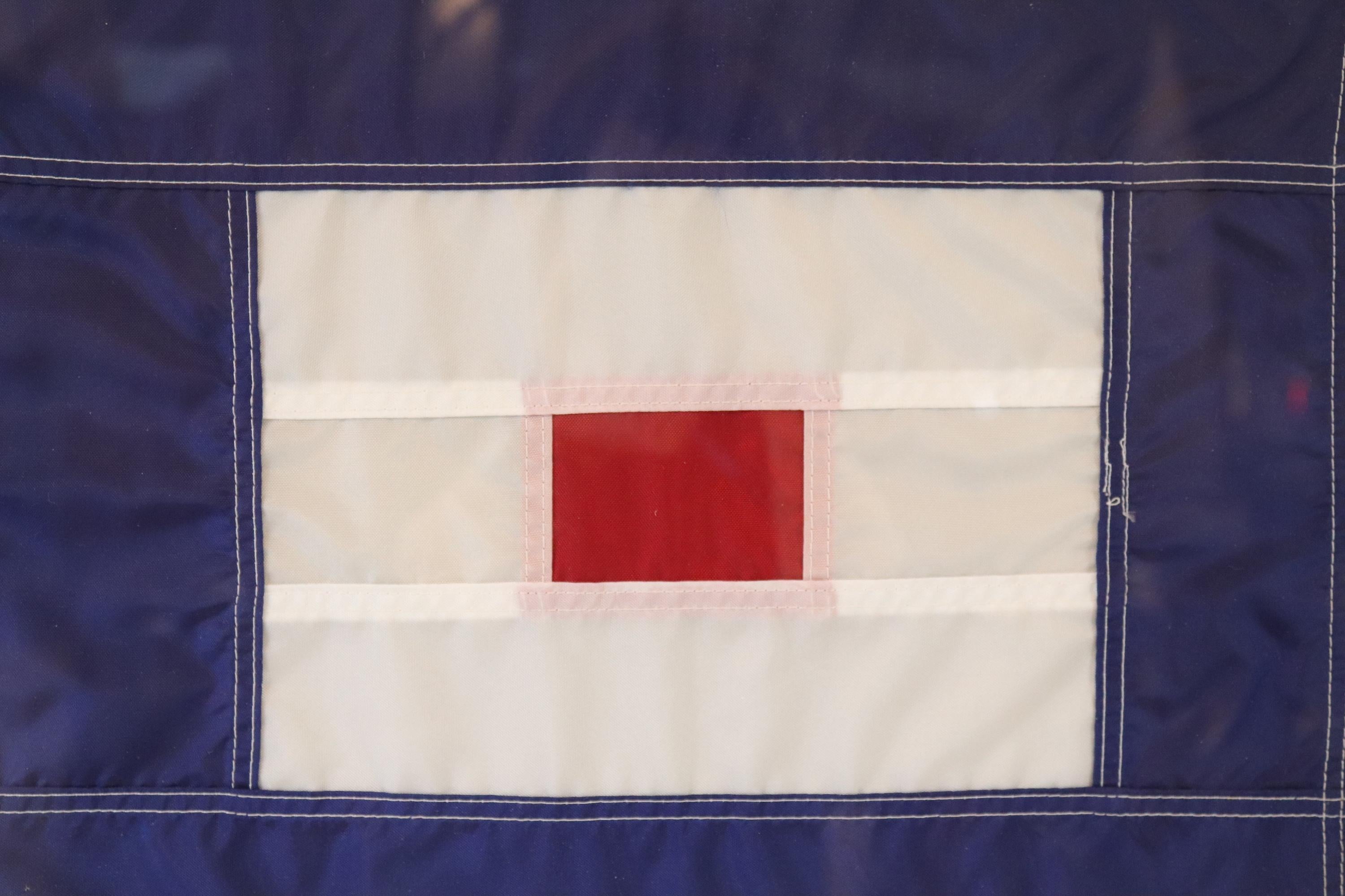 International maritime signal flag of nylon in frame. Flag stands for letter 