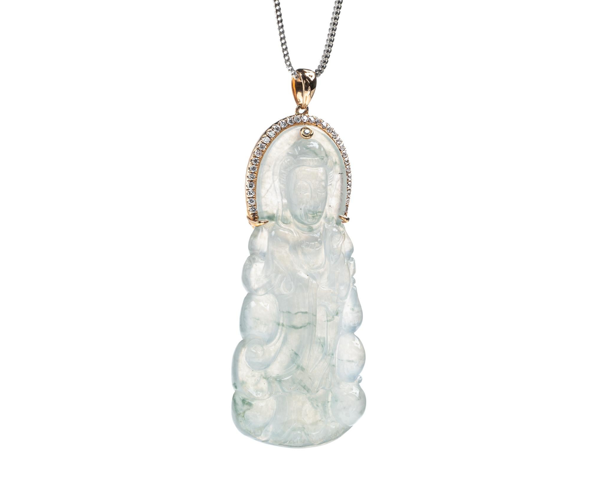 This is an all natural, untreated icy jadeite jade with green jadeite jade veins carved Quan Yin god and diamond pendant set on an 18K rose gold and diamond bail.  The carved Quan Yin god symbolizes peace and compassion.   

It measures 2.08 inches