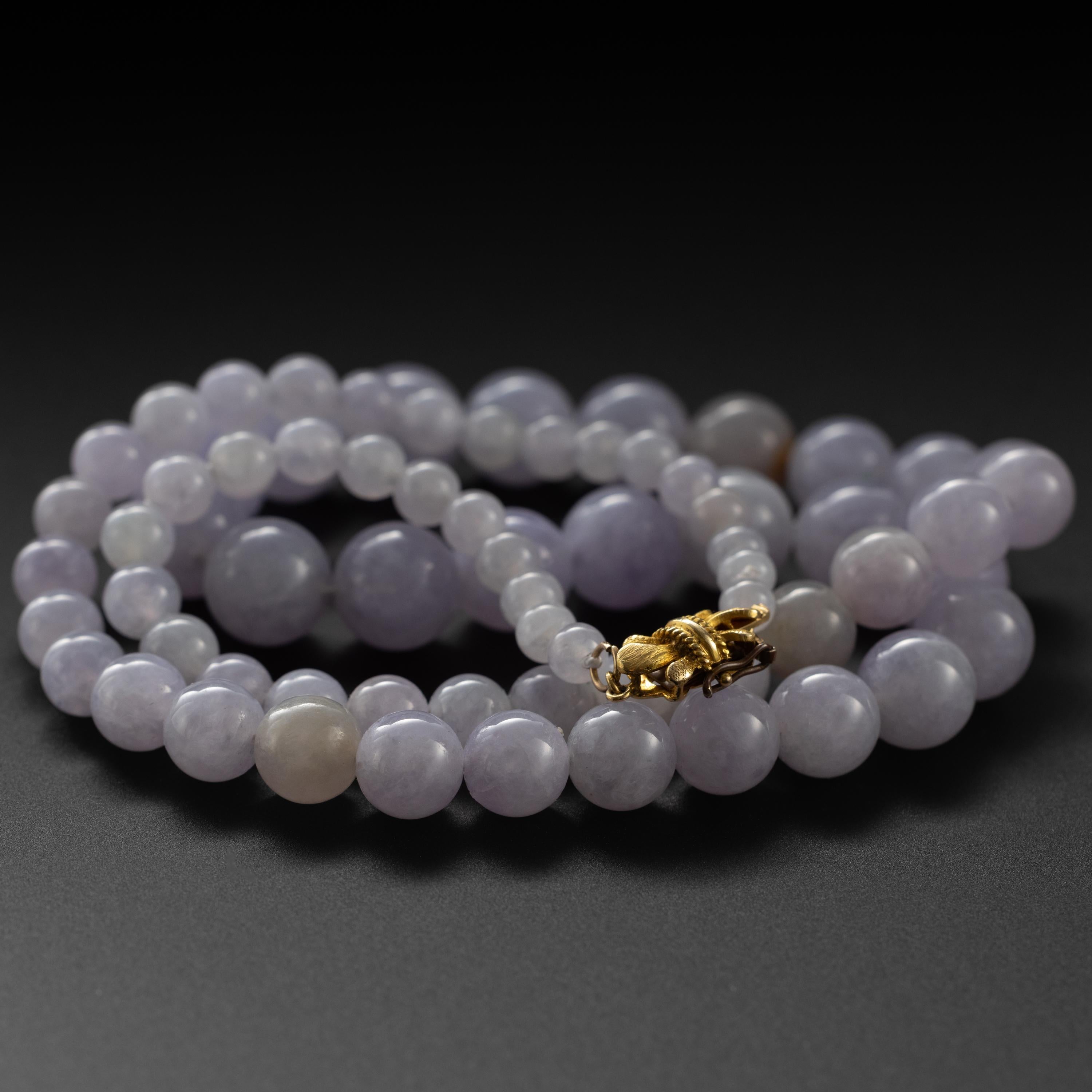 Ethereal and so brutally beautiful, you feel the impact of it in your solar plexus. 70 light violet hand-carved natural and untreated jadeite jade beads create a necklace that is 23