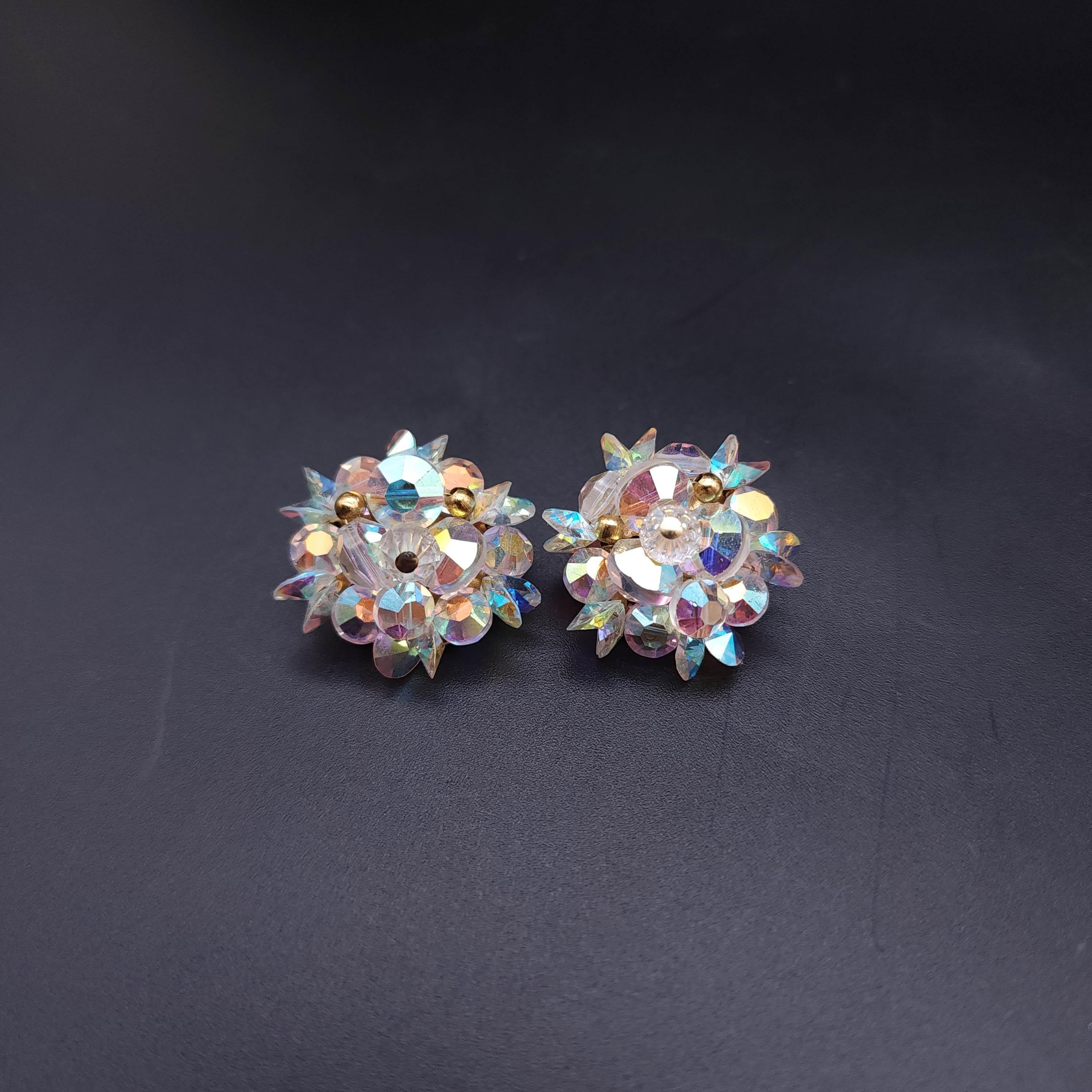 Add a touch of classic glamour to your ensemble with these icy white aurora borealis crystal clip-on earrings in a luxurious gold finish. These vintage beauties are a testament to timeless elegance, featuring dazzling icy white crystals with an