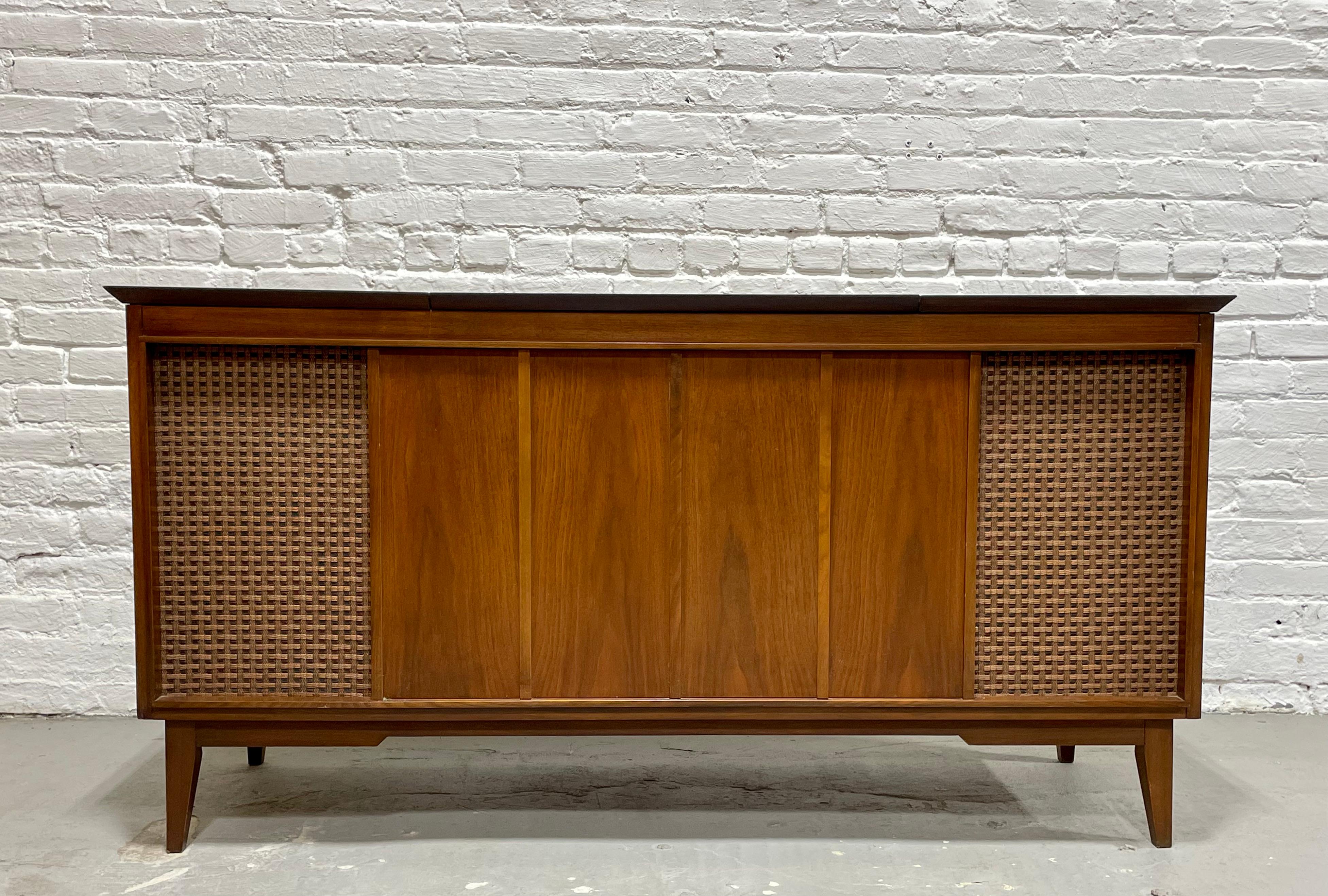 Mid Century Modern FULLY FUNCTIONING Walnut Fischer Diplomat Stereo Console / Credenza, c. 1960's. This rare and sought after piece is fully functioning with incredible sound and features a Fischer turntable, stereo and speakers behind the original
