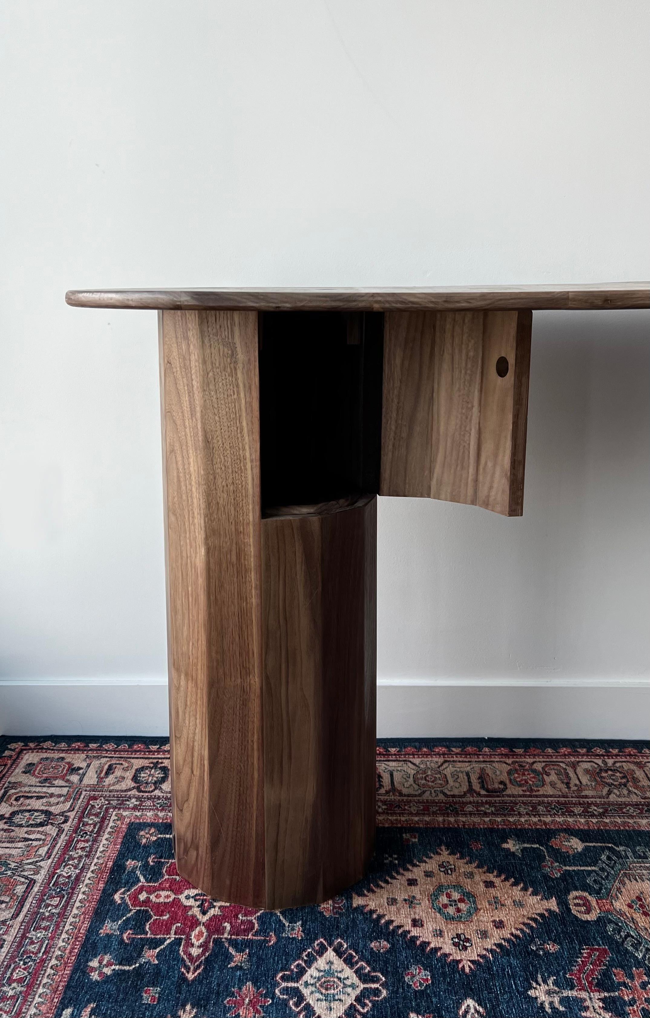 This desk is a study in fluid architecture—an exploration of how far lines can be pushed before they break. With no hard corners to disrupt its movement, each curve flows into the next, creating an uninterrupted visual and tactile experience. The