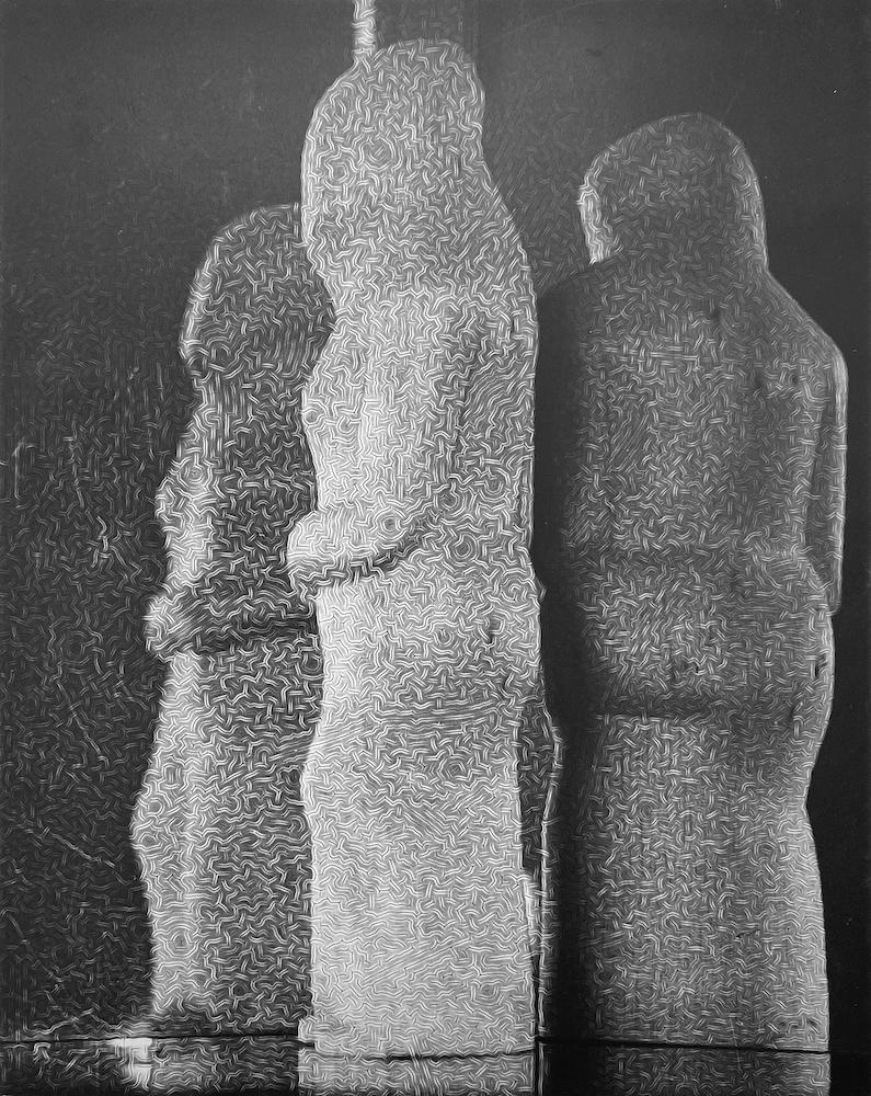 Contemplation by Ida Lansky depicts a group of three statues. The  figures are turned towards each other and away from the viewer, as if talking in secret. 

This photograph is listed as a 9.5 x 7.5 inch vintage silver gelatin print. It is signed