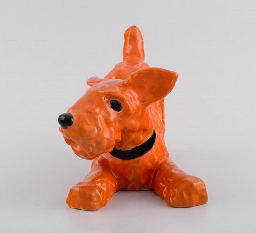 Ida Meisinger (1897-1985) for Goldscheider. Playful terrier in glazed ceramics. Beautiful glaze in orange shades, 1930's.
Measures: 18.5 x 14.5 cm.
In excellent condition.
Stamped.