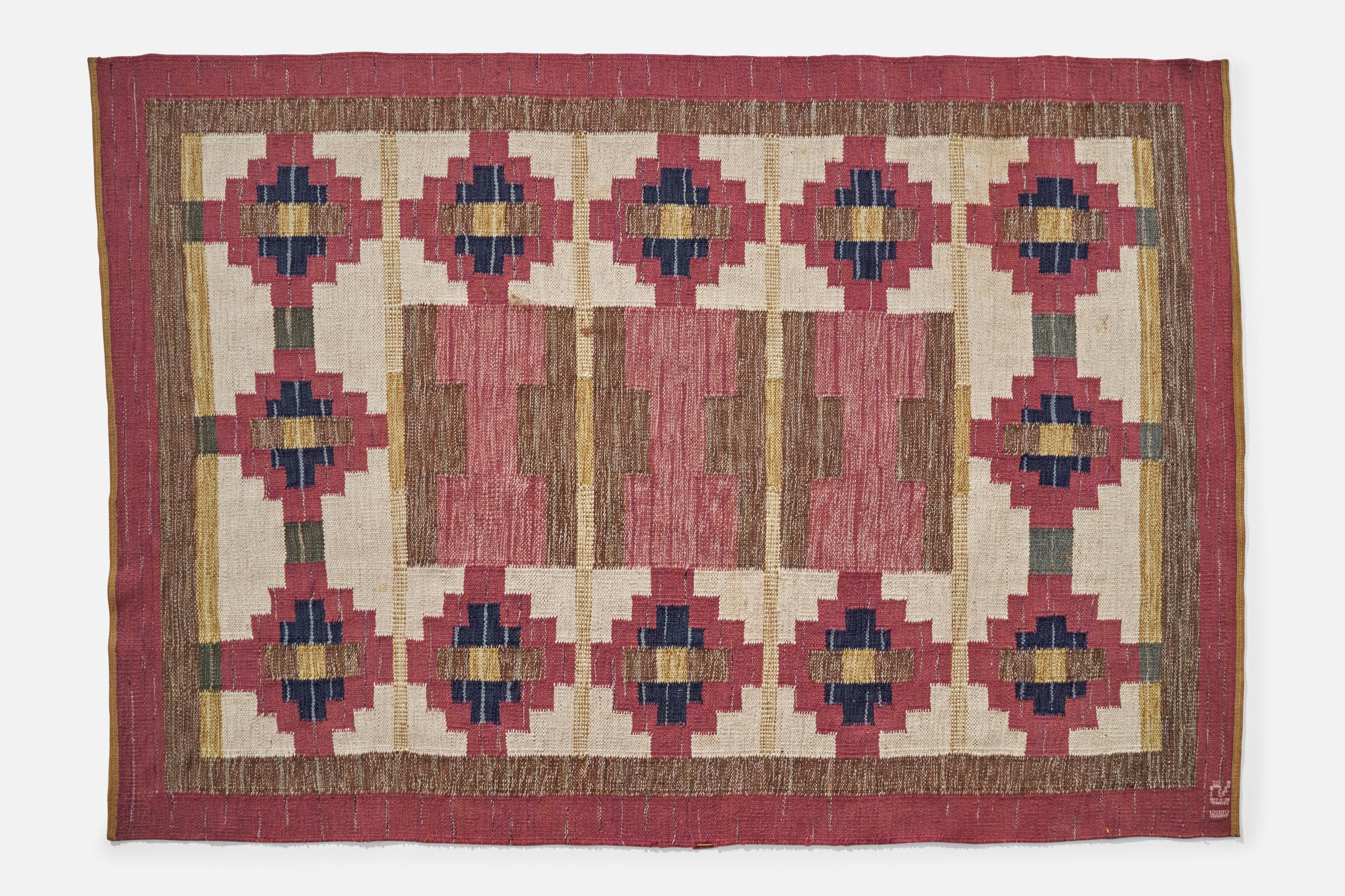 Tapis en laine à tissage plat rose, marron et violet, conçu et produit par Ida Rydelius, Suède, vers les années 1950.
