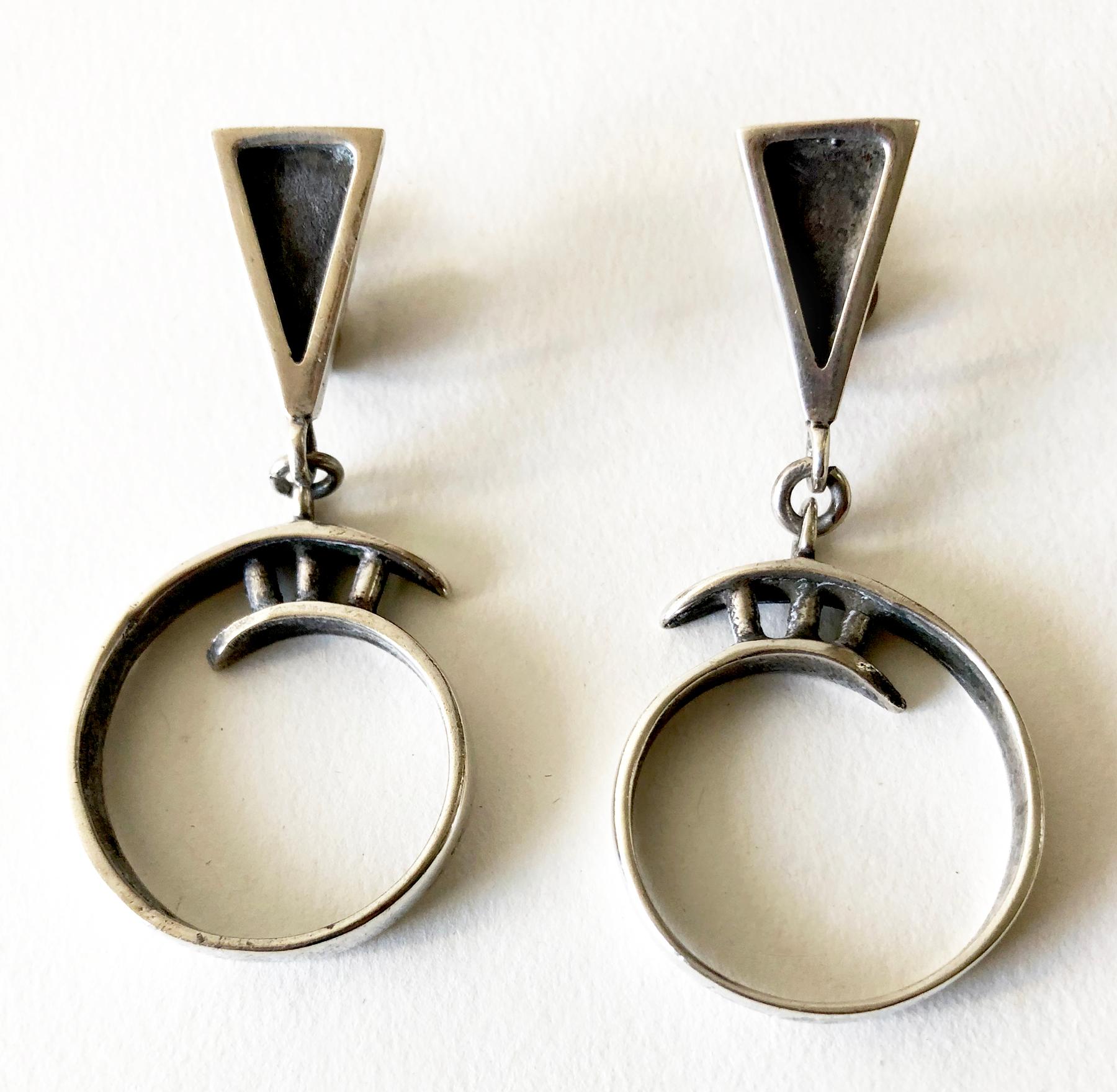 Sterling silver dangling screwback earrings created by Idella La Vista of New York, New York.  Earrings measure 2.25