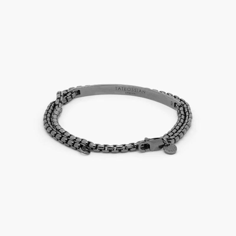 Identity Chain Bracelet In Brushed Black Rhodium Plated Sterling Silver, Size L

Our silver box chain has been extended into a sleek double wrap bracelet, with a smooth, curved bar decorated with our hallmarks. Finished in matte black, rhodium