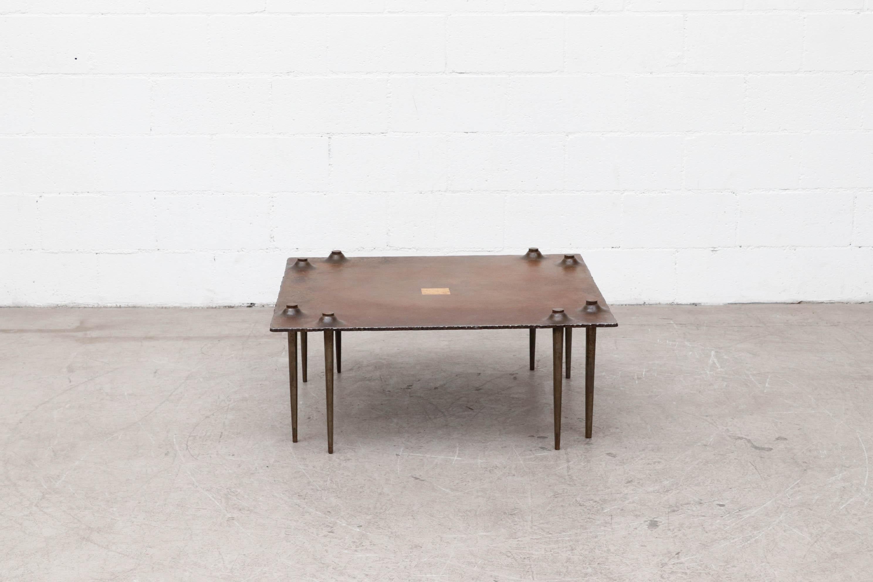 Large square Brutalist metal coffee table with forged steel legs poking through the welded steel top by the late Idir Mecibah (1958-2013) for Smederij Moerman, 1998. Most of his Mecibah's work is not being produced anymore and is destined to be