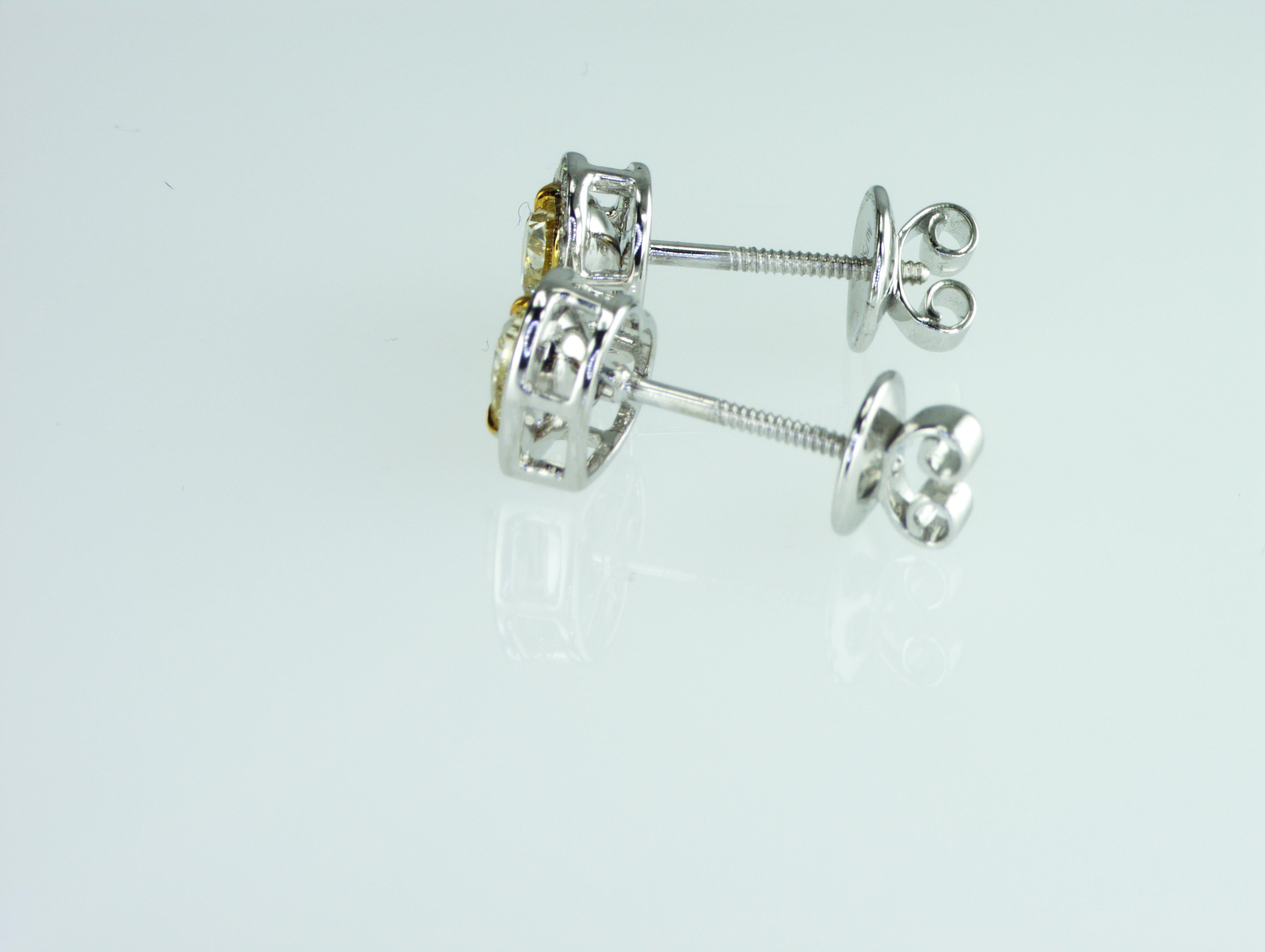 IDL certified 1.42 carat Fancy Yellow Heart shape natural diamonds Earrings In New Condition For Sale In Dubai, UAE