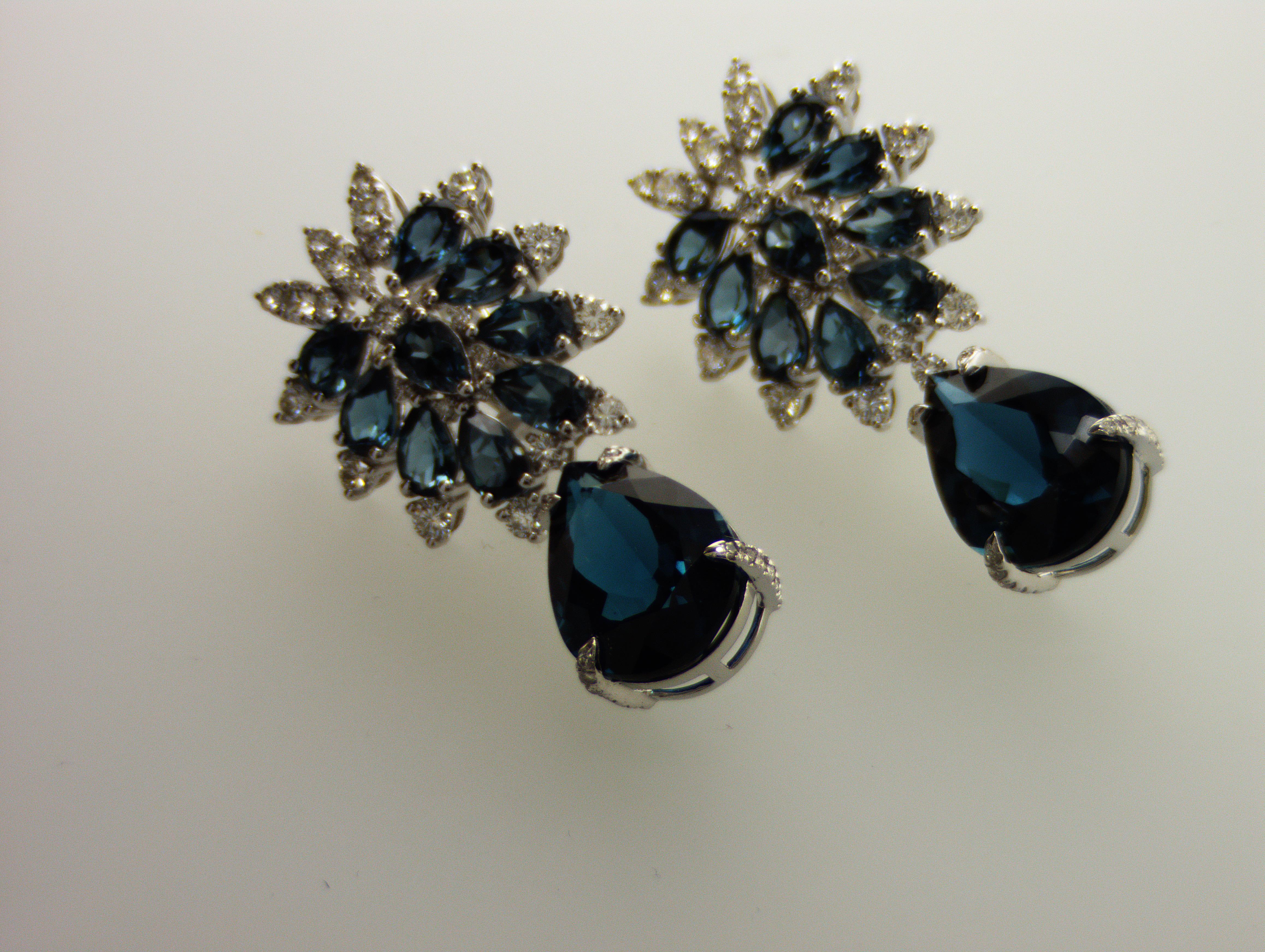 Amazing IDL certified London Blue Topaz (26.97 ct.) and Diamonds (2.33 ct) Earrings. These earrings outstandingly looks, London blue topaz has a very specific , inky shade of blue and it is darker then regular topaz but lighter then a sapphire.