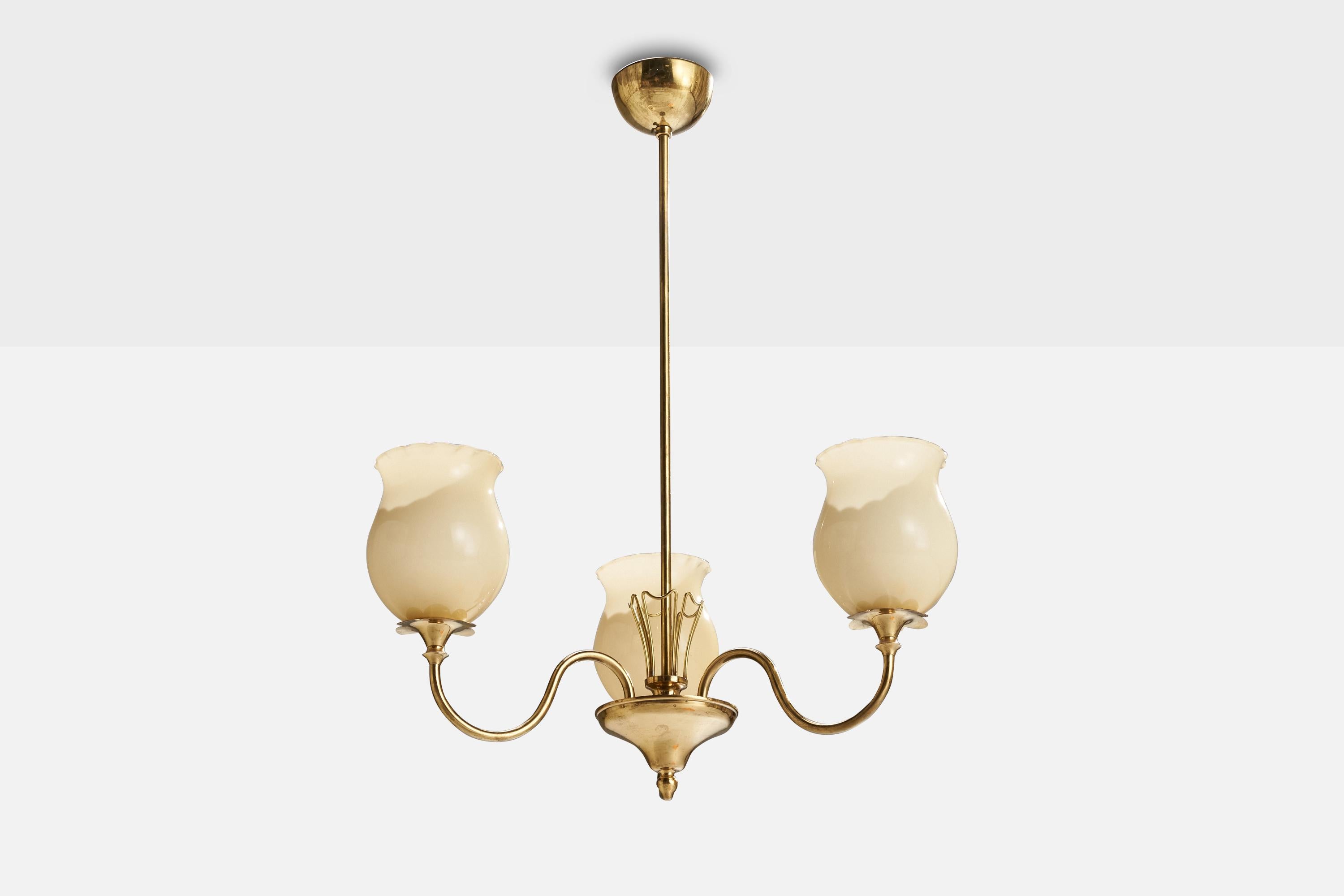 A brass and opaline glass chandelier produced by Idman, Finland, c. 1940s.

Dimensions of canopy (inches): 3.92” H x 2.60” Diameter
Socket takes standard E-26 bulbs. 3 socket.There is no maximum wattage stated on the fixture. All lighting will be