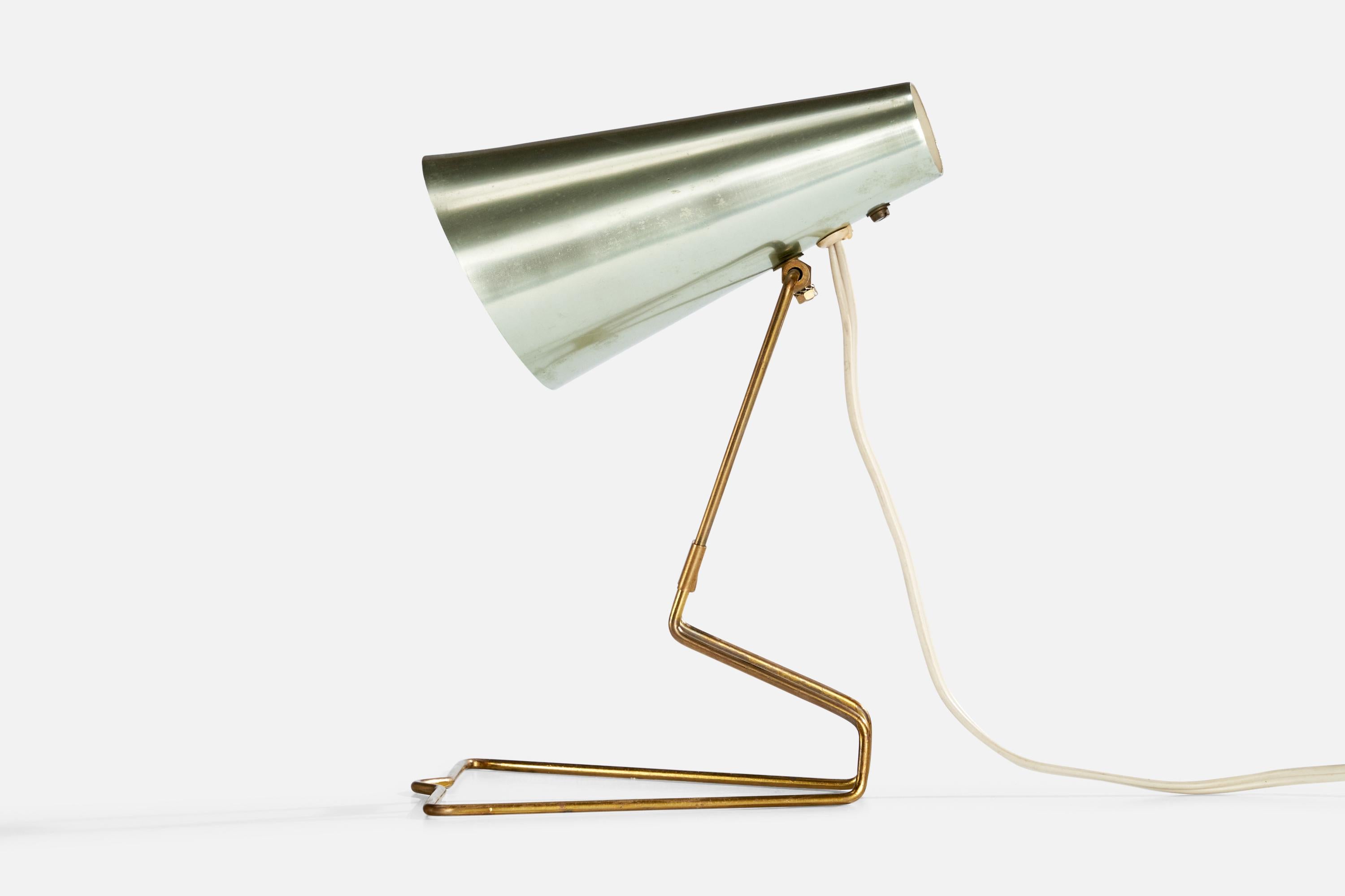 A brass and aluminum table or wall light produced by Idman Presenta, Finland, c. 1950s.

Overall Dimensions (inches): 9.5” H x 6.6” W x 7” D

Bulb Specifications: E-14 Bulb

Number of Sockets: 1